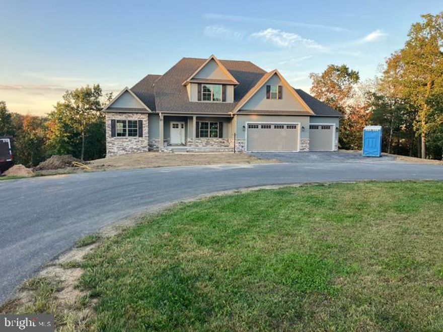 Welcome to Melrose Meadows III, where quality craftsmanship meets thoughtful design. Currently under construction by Greenworth Homes, this stunning Weston model is located on a spacious corner lot in a quiet cul-de-sac on Helens Drive. This home features 4 bedrooms, 2.5 bathrooms, and an unfinished walk out basement, offering plenty of space and future potential. The primary suite is conveniently located on the main level and includes a private en-suite bath. The main level also offers laundry, a gas fireplace in the great room, and an open-concept layout that seamlessly connects the kitchen, nook, and great room. Enjoy outdoor living with the lower-level patio, and admire the beautiful stone and vinyl front exterior that adds curb appeal. Upstairs, you’ll find three additional bedrooms, offering flexible space for family, guests, or a home office. Additional features include a 3-car garage and a generously sized lot, giving you the room to grow in a beautiful neighborhood.