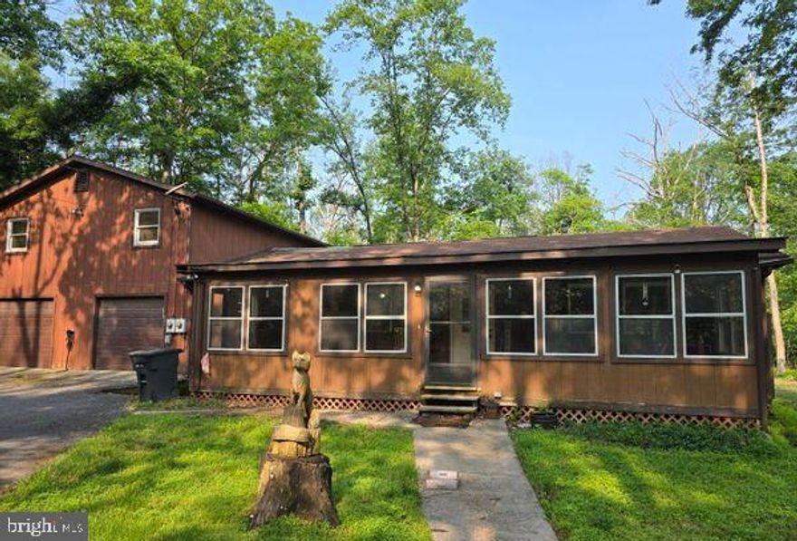 Priced To Sell Fast! Investor Alert! Desirable Rambler with Large Attached 2 Car Garage, Apartment above Garage, Spacious Kitchen, Spacious Bedrooms, 2 Wood Burning Stoves, Sunroom, Deck, Storage Shed, 5.63 Acre Lot, Much More!!  Just Waiting For Your Personal Cosmetics and Renovations to Make it Shine. Close to Schools, Shopping and Commuter Routes.  This Will Not Last! Sold As-Is.