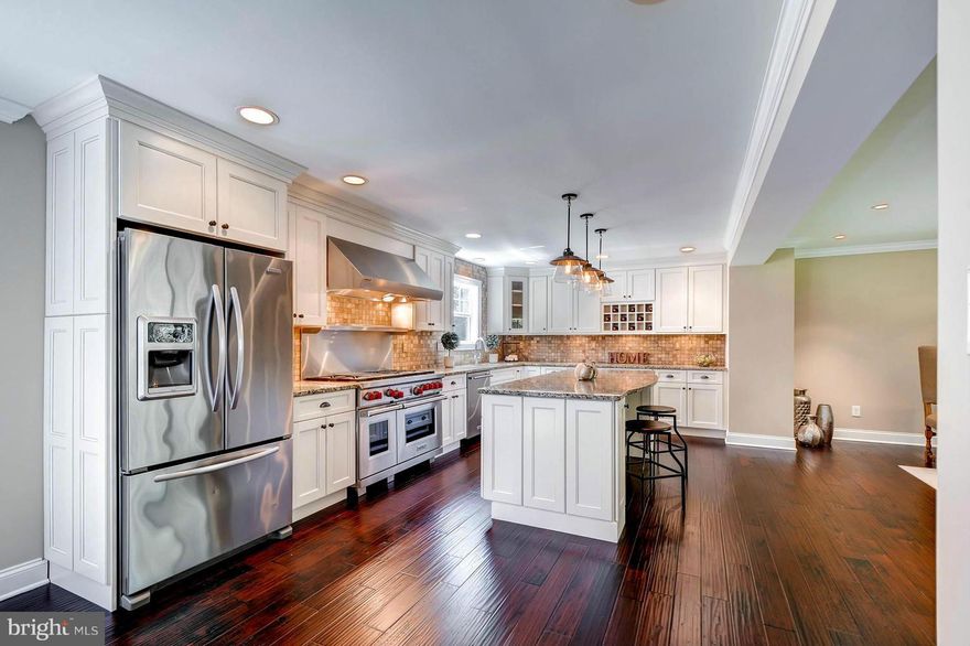 Fantastic 2016 renovation from top to bottom with Master Bedroom addition, 3338 Sq Ft. Finished. State of the art kitchen includes Wolf Range, Granite Counter tops, SS Appliances. Large center Island with Breakfast Bar. Fully finished basement with built-in Bar. Three and half fully renovated bathrooms.  Stone patio, large tree lined yard with outbuilding suitable for storage, work shop, etc.