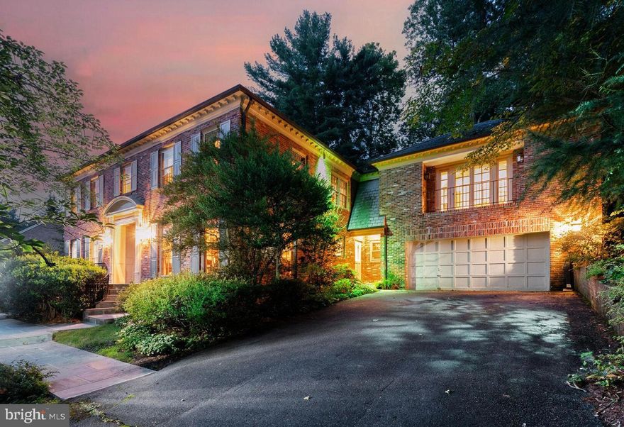 GREAT NEW PRICE ADJUSTMENT!! Fabulous opportunity to update and personalize this stately hillside home on a quiet drive in coveted Bannockburn Estates – an ideal property for entertaining on both a grand and intimate scale. The first level features a wide center-hall foyer, an elegant, embassy-sized living room, formal dining room, table-space kitchen, main-floor laundry, a large paneled family room with wet bar and powder room, plus a glass-enclosed sunroom with access to a flagstone patio, multi-level pool area and a wooded path with two more patios above. The second floor boasts four spacious bedrooms and three baths, including an expansive sitting area/office off the primary bedroom with built-ins and storage galore. The walk-out lower level offers a large paneled rec room, full bath and bonus room. With more than 6600 sf of living space, three fireplaces, slate & copper roofing, lush grounds, a double garage, extensive hardscaping, exterior lighting, an in-ground sprinkler system and more, all on a 20,000+ sf lot, this property is truly an oasis to call home.