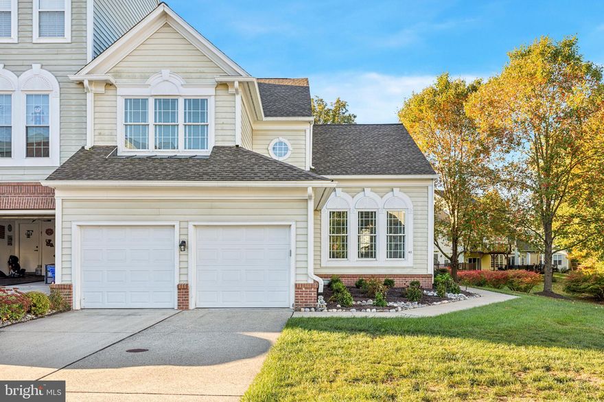 Introducing a luxurious and meticulously cared for end unit home in the prestigious Doylestown Station residence, where modern elegance meets ultimate privacy. This custom home has been fully renovated to showcase top-notch features and a sophisticated design that exudes warmth and comfort.

As you approach this stunning property, you are greeted by beautifully landscaped surroundings and a convenient 2-car garage with a driveway, offering ample parking space. Step inside to a breathtaking foyer that leads to a spacious living area and a separate dining room adorned with custom millwork, cathedral ceilings, and elegant chandeliers. The restored handcrafted hardwood floors add a touch of timeless beauty to the space, complemented by surround windows that flood the rooms with natural light and a cozy gas fireplace perfect for intimate gatherings.

The open floor plan seamlessly transitions into a spectacular eat-in Chef’s kitchen, which has been recently restored to feature high-end granite countertops, GE Profile stainless steel appliances, contemporary handcrafted cabinetry, side breakfast seating area, high end fixtures and deep soaking sink. The vaulted ceiling in the breakfast area enhances the ambiance, while the kitchen with slider doors opens up to an expansive deck ideal for outdoor entertainment and dining al fresco The deck, completed in 2017 with Trek material and an automatic awning, overlooks a lush garden, creating a serene retreat for the ultimate in relaxation.

The primary suite on the main floor is a haven of tranquility, boasting hardwood floors, a picturesque garden view, and a spa-like bathroom with a deep soaking tub, glass-enclosed shower, and dual vanity sinks. A laundry room and a custom newer half bath complete the main level.

Upstairs, is just as lovely and includes a loft area which offers versatility as a swank home office or exercise space this along with two spacious and pretty  bedrooms featuring ample closet space and a full custom-tile adjoining bathroom.

The lower level presents a fully finished gigantic basement designed for entertainment and relaxation, featuring another gas fireplace, built-in bookshelves, and recessed lighting. A full bathroom with custom tile finishes and a vanity adds convenience, while extra closet space provides storage solutions. The mechanicals of the home are in top-notch condition, with an updated HVAC system, H2O water softener, a 50-gallon Bradford White water heater, and a generator installed in 2018, ensuring comfort and efficiency.

Don't miss the opportunity to own this pristine home that offers a blend of luxury, privacy, and modern convenience in a desirable location. Schedule a showing today and experience the epitome of upscale living at its finest. also located in the great Central Bucks school district!