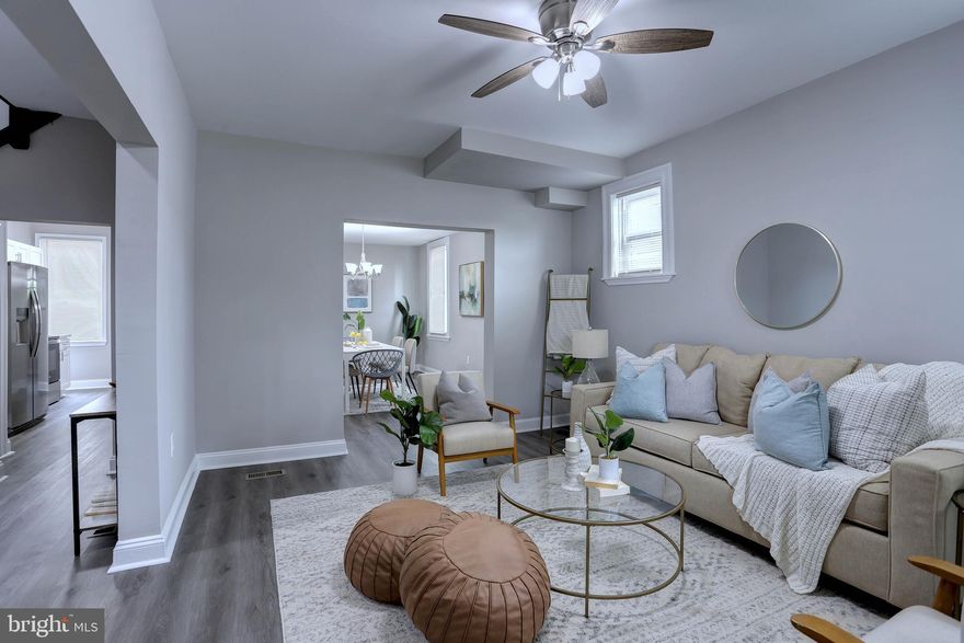 Newly renovated, semi-detached home. Three fully finished levels. A total of five bedrooms and three full baths. Open floor concept. The kitchen has gleaming white cabinets, stainless steel appliances, an island with counter seating, and a formal dining area. Additional room off the kitchen could be an office or mudroom with rear entrance access.  Spacious living room with an abundance of windows. High ceilings throughout. Beautiful LVP flooring on the entire main level.  Upper-level primary suite with a full bathroom. 3 additional bedrooms and full bath. The lower level has a rec room, game room/office, 2 storage rooms, separate laundry room, fifth bedroom, and full bath This home has so much to offer. New HVAC and HWH. Newly waterproofed basement. Large rear yard with potential alleyway access for parking. Beautiful stone front porch. Walking distance to the Liberty elementary school, shopping /dining, Forest Park Golf Course, Gwynn Falls Trails, and Historic Dickeysville. Conveniently located near public transportation and local highways.