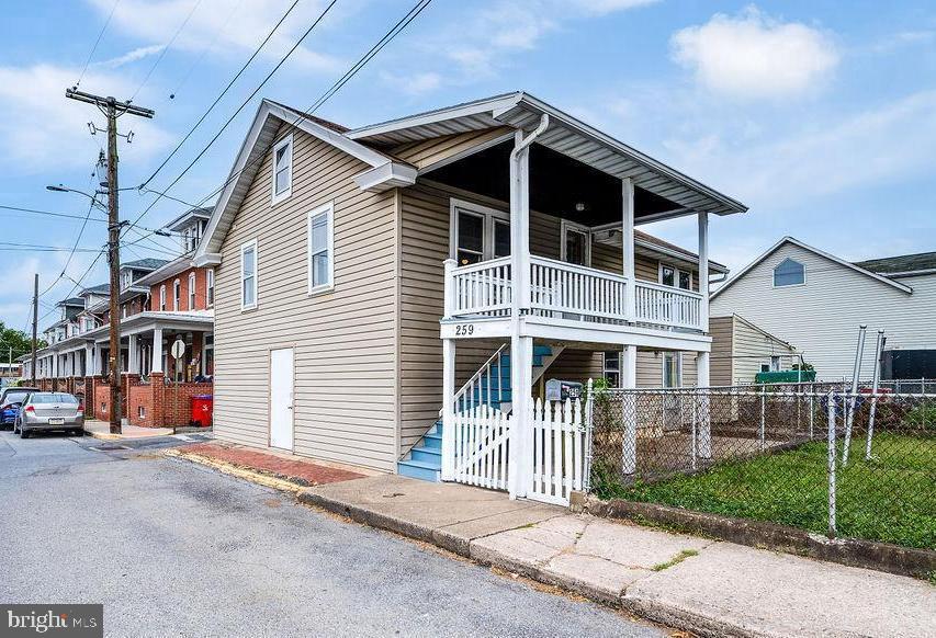 Charming 2-bedroom in downtown Hamburg. Spacious lower level for workshop or finish for more living space. Upstairs offers large rooms and a retro kitchen, plus a bonus room on the top floor. Enjoy a 2nd-story deck overlooking the patio with dual lower-level access. Affordable and low-maintenance!