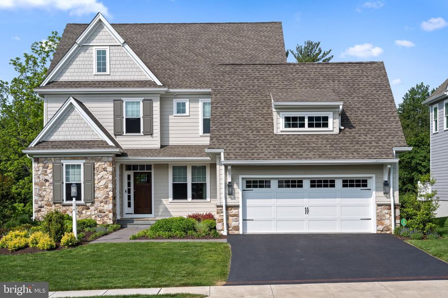 Proudly presenting this highly upgraded and sophisticated property in the award winning community of Chapel Hill. Simply unpack your bags and start enjoying a wonderful turn key lifestyle. Ideally situated on a premium lot backing to lush greenery and landscape, this home offers a peaceful environment. Neutral tones throughout create a light and serene ambiance. The desirable floorplan features three Bedrooms and two full Baths on the second floor with a fantastic daylight and walk out finished Lower Level with versatile space and another full bath with a steam shower. Some of the many special features to note are site finished hardwood floors, transom windows above numerous doors, Laundry on both 1st and 2nd floors, coffered ceiling in the Family Room with a custom mantle above the gas fireplace, a custom designed Butler's Pantry, switchback stairs outdoors leading from the composite deck to the wonderful patio below with its gas fireplace, professionally outfitted garage storage, a whole house Generator and the list continues!  The first floor offers a show stopper gourmet Kitchen with an expanded Breakfast and Sitting Area to comfortably host gatherings both small and large. With Dove White upgraded cabinetry, quartzite counters, marble backsplash, upgraded Miele appliances with a built-in Miele coffee maker,  Subzero refrigeration and additional refrigerator drawers and storage galore, this Kitchen is a chef's delight. The adjacent Family Room, which is open to the Kitchen space, offers beautiful views of the rear landscape with its coffered ceiling, gas fireplace and built-in cabinetry. A formal style Dining Room opens to the lovely and super functional Butler's Pantry with more Dove White cabinetry, special lighting, marble countertop and a beverage refrigerator.  Enjoy working remotely in the home Office with great light and built-in shelving and cabinets. A formal Powder Room, Mud Room, Laundry and access to the 2-car Garage complete this well designed level.  Upstairs boasts the Primary Suite which feels like a sanctuary. This suite includes a spacious Bedroom with tray ceiling, hardwood flooring,  his & hers custom outfitted closets with pockets doors, a Laundry closet with stackable washer & dryer and a spa-like Bathroom with radiant heated flooring, expanded shower with multiple shower heads, double white vanity with marble counter and a water closet. Additionally on this floor, discover the 2 generously sized guest Bedrooms with plush carpet, ceiling fans, outfitted closets and a Jack and Jill Bathroom with a tub/shower combination.  The finished Lower Level with great ceiling height is quite welcoming. Boasting  walk out, on grade, access to the patio and rear yard and numerous large windows, the rooms are light-filled. The Recreation area is terrific for TV watching and hosting friends and family. Sliding Barn doors provide access to another generously sized room which is currently used as a Gym. This room with a large closet and numerous windows is very flexible space. A full Bath is so convenient especially with its steam shower. Plenty of storage is in the unfinished space which also houses the 2 tankless water heaters and other mechanicals.  The Chapel Hill Homeowners Association includes lawn maintenance, irrigation of the front lawn and beds, mulching and weeding of the front beds, snow removal to your front door and driveway, trash and recycling and street maintenance. Enjoy this wonderful property and lifestyle which is so easy to call "Home"!