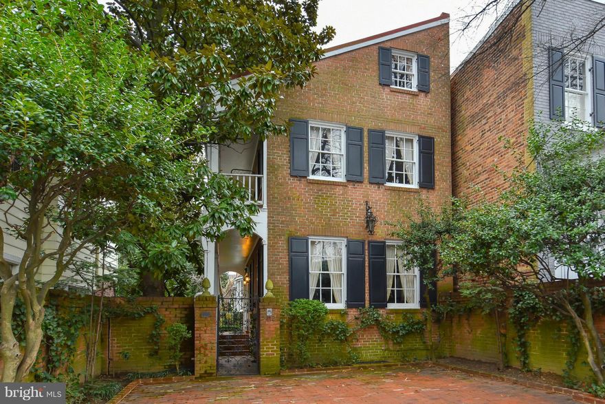 This traditional style "flounder" home with Charleston porch is truly reflective of early Old Town architecture including gracious rooms with beautiful woodwork and reclaimed pine floors, five fireplaces with antique mantels, commodious bedrooms, front and rear stairs, two off-street parking spaces and a serene sheltered garden.  Just announced 2016 tax assessment is $1,765,389.