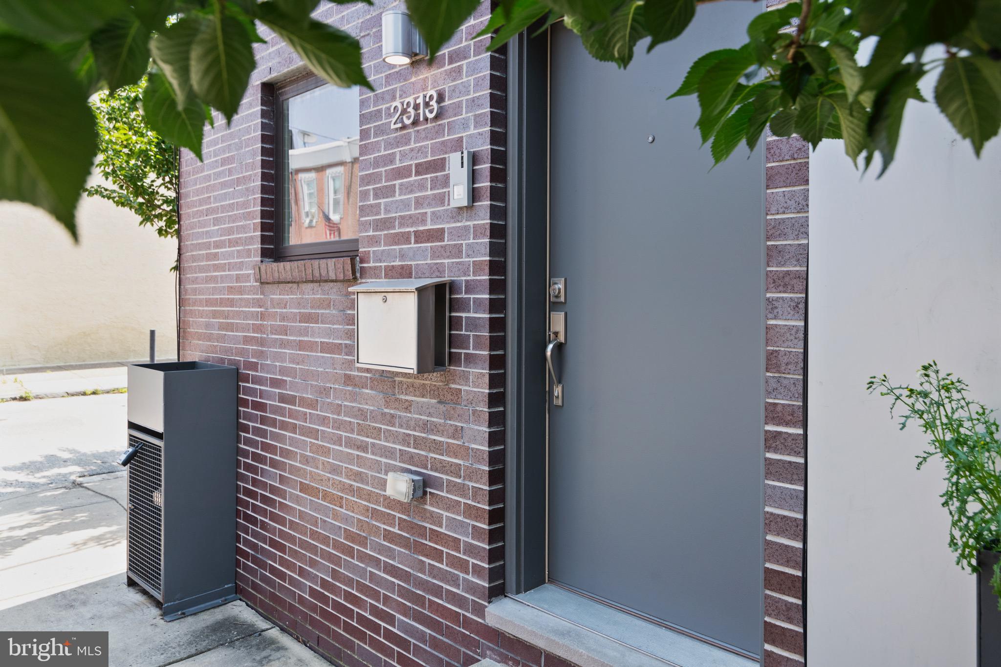 Welcome to 2313 Tulip Street, a premier corner townhome located in the heart of Fishtown just steps away from Konrad Square Park! Step inside to find natural light pouring in from three exposures and an open-concept layout for the living and kitchen areas. The kitchen features modern dark cabinetry, light quartz countertops, and stainless steel appliances. Just off the kitchen, a private back patio provides a great space for outdoor dining and relaxing. The second floor hosts two bedrooms and a contemporary styled bathroom. The third floor is its own master suite, complete with an upscale bathroom design that features a double sink vanity and a frameless-glass standing shower. The roof deck has stunning views of the city skyline and surrounding neighborhood. A fully finished basement with a half bath offers additional flexible space for a home office, gym, or media room. Conveniently located to all of Fishtown's restaurants, retail, and provides easy access to major highways.