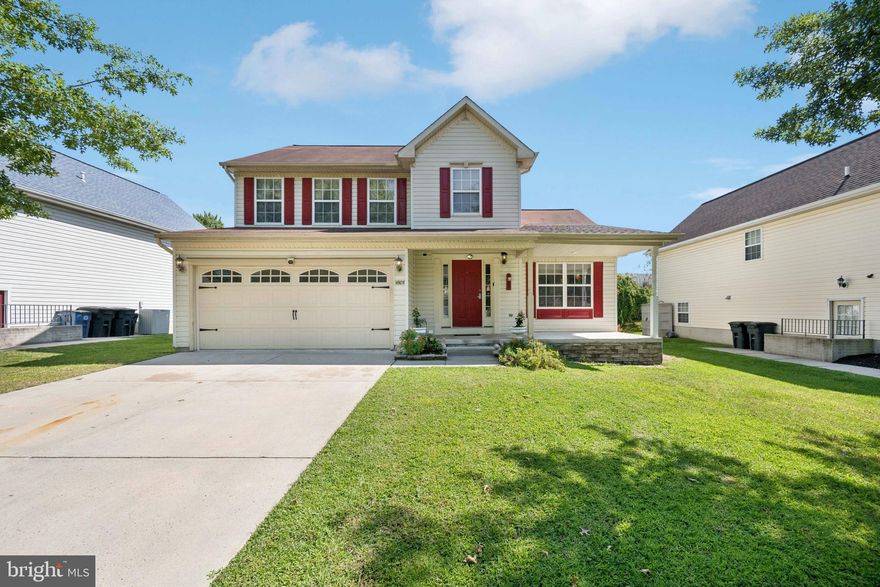 Charming Front-Porch Colonial with an open kitchen, inviting family room, and a vaulted-ceiling great room highlighted by a cozy gas fireplace. French doors open to a two-tier deck, patio, and beautifully landscaped grounds—perfect for entertaining.

The walkout lower level offers additional living space, ideal for guests or recreation. A two-car garage, currently finished as an in-law suite, allows for easy conversion back to traditional garage use.

Recent Updates include, Living bath (2021), primary bath (2021), water heater (2021), gas range (2024), and refrigerator (2025).