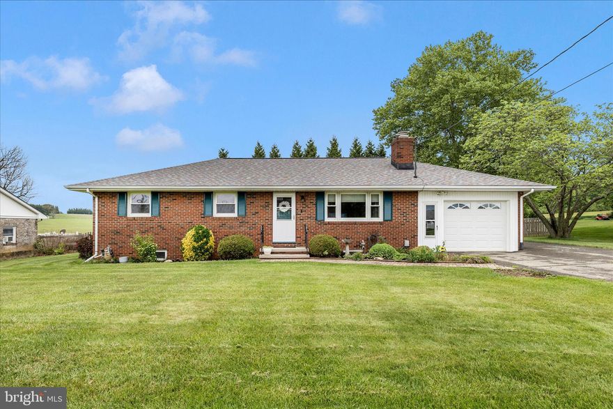 Don't miss out on this very well maintained all-brick rancher situated on a level, half acre lot!  This charming home features many updates and newer features -- including roof, water treatment system, well pump and much more.  The kitchen boasts of solid surface countertops, tile backsplash and stainless steel appliances.  Entering the living room, you will find a brick hearth fireplace and bright space thanks to plenty of windows.  Just down the hallway is a convenient full bath and three bedrooms, including a primary bedroom with adjacent half bath. Hardwood and ceramic tile floors are featured throughout the main level bedrooms and baths.  
On the lower level, you will find an additional full bath, craft/sewing room, large workshop, two storage areas, laundry and areaway leading up to the fully fenced back yard.  
Enjoy the outdoors on the brick-paver patio with permanently attached gazebo-type structure which provides comfort & shade in the summer months.  There is also a shed in the rear yard for storage of gardening tools, lawn mower, etc. 
Opportunities like this don't come along often so act fast!