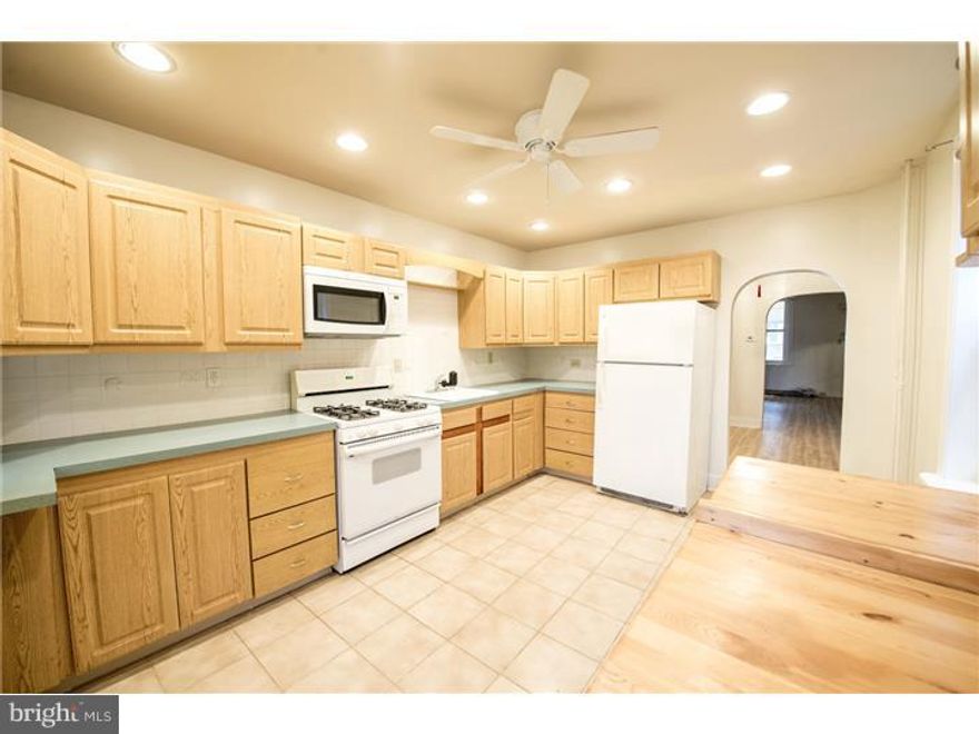 Bright and spacious 2 story home on wide up and coming block in the burgeoning Cedar Park neighborhood.  3 bedrooms.  New wide-plank laminate floors throughout.  Spacious, eat-in kitchen.  South-facing sun porch.  Great layout with large living area, dining room, big eat-in kitchen overlooking the nice-sized patio.  Nice home; great value; excellent location on a wide and sunny block.  Located within a couple blocks of Mariposa Food Co-op and popular restaurants like Vietnam, Vientiane Cafe, Dock Street & Gold Standard. Satellite Cafe, LittleBaby's Ice Cream.  Just minutes from Clark Park Farmers Market; all that University City has to offer; Multiple SEPTA lines.