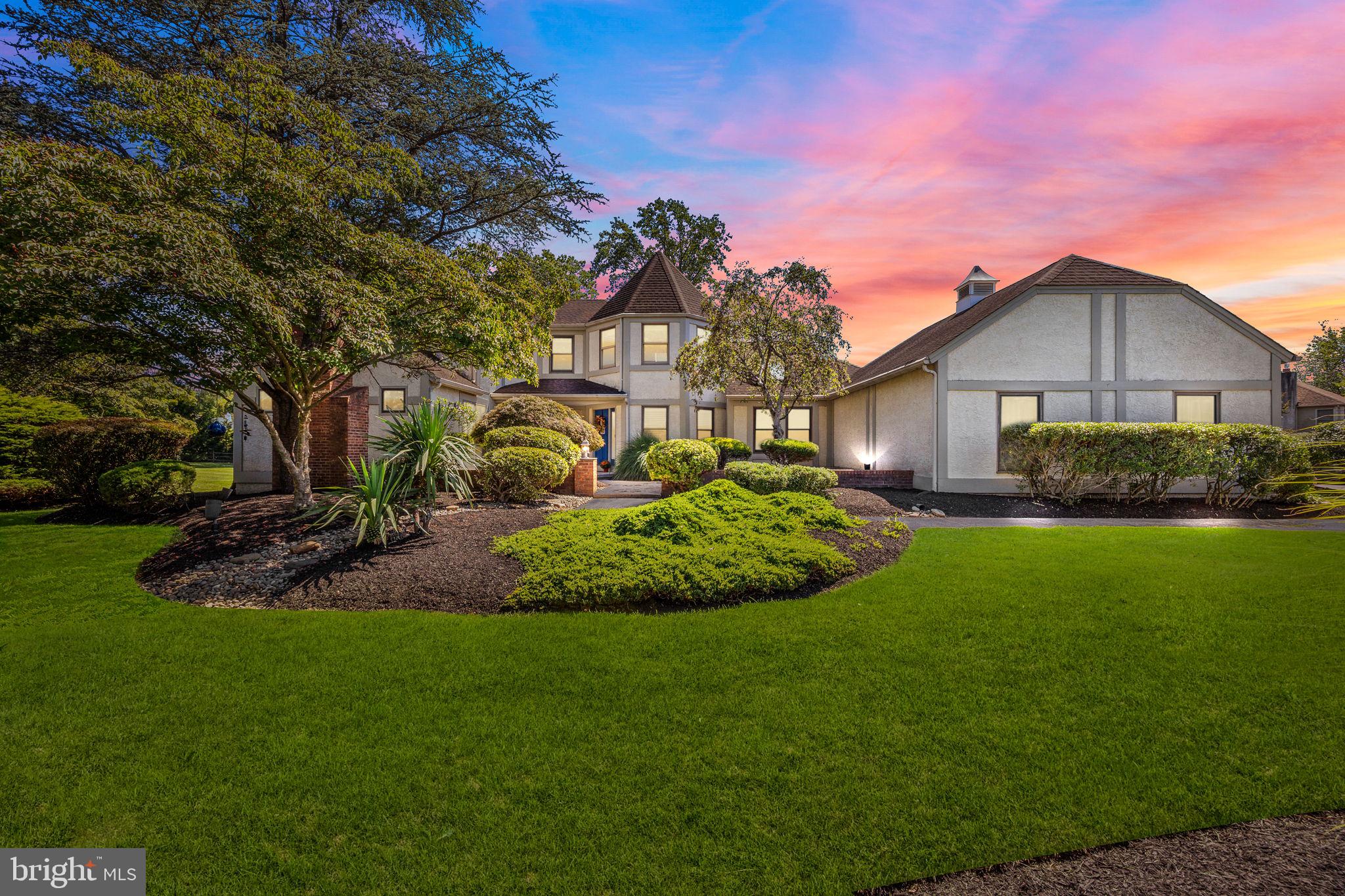 This rarely offered Manor home in Eagles Mere has been thoughtfully maintained and extensively updated over the years. Upon entry, the residence welcomes you with a striking two-story foyer featuring an elegant upper-level bridge. A key highlight of the property is the first-floor wing, which presents an impressive owner's suite complete with a spacious bedroom, comfortable sitting area, custom walk-in closet, and a remodeled bathroom showcasing a double sink granite vanity, MTI 20 jet air tub with heated air blower, and gas fireplace.
The kitchen is designed to accommodate the most discerning culinary enthusiasts, offering custom wood cabinetry, ceramic tile flooring, granite countertops, dual Wolf ovens (one steam/convection), and a six-burner propane gas Wolf stove with a pop-up vent. Additional high-end appliances include a professional-grade Miele dishwasher, Sub-Zero wine refrigerator, Sub-Zero refrigerator and a seating bar area with a mounted TV overlooking the family room. The family room is accentuated by a cathedral ceiling with skylights, a propane gas fireplace, a large wall-mounted TV, and sliding doors leading to a Trex deck. The living room provides access to the front courtyard and a decorative gas-log fireplace. The formal dining room also offers direct access to the Trex deck through sliding doors.
The upper level includes three generously sized bedrooms, each appointed with newer neutral carpeting, walk-in closets, and ceiling fans. One bedroom is enhanced by a double-door entry and a renovated en-suite bath with Carrera marble flooring and a quartz countertop, while the remaining two bedrooms are served by a remodeled hall bath featuring a quartz double-sink vanity and a stall shower with a custom glass door.
A spacious, impeccably clean unfinished basement offers a dedicated wine cellar highlighted by a stone entry with a custom crafted wooden door. Additional features of this exceptional property include a three-car garage, a security system ( contract ended 2025 ) & lawn irrigation system which has been in used yearly but was not activated for the 2025 season, two new water heaters (2024), dual-zoned heat pumps with oil backup for the main floor, mostly replaced windows, refinished oak flooring, and fully renovated bathrooms and kitchen - All on an expansive, professionally landscaped lot. Don't miss out on this stunning home rarely offered in prestigious Eagles Mere!