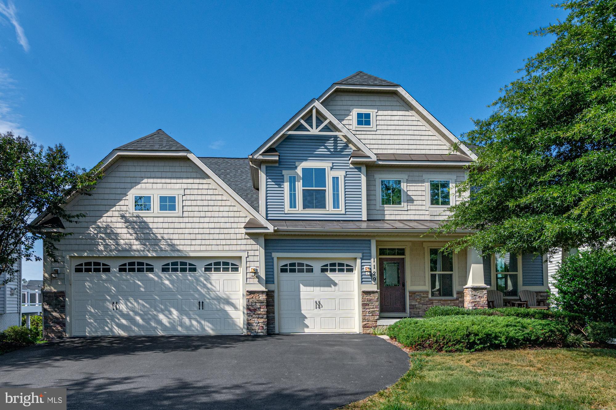 ***Stunning Landon model, with almost 5,000 finished sq ft on three levels with tons of beautiful upgrades throughout! Gorgeous craftsman style elevation with shake siding, front porch, and 3-car garage greet you as you pull up on this pretty lot and street in the heart of Brunswick Crossing. Well inside, you will immediately notice the beautiful hickory hardwood floors on the entire main level. The formal dining room with coffered ceiling and extra windows has ample space for the largest holiday meals, and there is more casual seating to be had in the stunning and bright morning room. The gourmet kitchen features white cabinetry, tile backsplash, and granite countertops. Stainless steel appliances, double wall oven and gas cooktop will make you enjoy cooking again, and your guests will be happily entertained around the large island. The spacious family room with a gas fireplace and a lovely row of windows with views of the large, brand new deck that was just installed is sure to impress, and you will love the stunning views for miles of mountains and treetops. Don't miss the practical office with French door, and the mudroom and powder room as you come in from the 3-car garage featuring EV outlet and Tesla charger. Upstairs, the serene primary suite features a tray ceiling, double walk-in closets and upgraded primary bathroom with oversized shower and separate vanities. There are three additional spacious bedrooms, two of them with a Jack n Jill bath separation and the guest room/ princess suite has an upgraded en-suite bathroom. The laundry room is also practically found here on the bedroom level. The sprawling daylight basement is completely finished with rec room that has a walkout directly to the backyard. Have your friends and family over for movie nights in the media room with built-in speakers! Practical 4th full bathroom on the basement level and storage room too. Come and see what living in Brunswick Crossing is all about with its resort-quality amenities such as swimming pool, tennis courts, baseball court, beach volley, fitness center, shaded walking trails for miles and on-site shopping. Brunswick is a charming old railroad town, with a great selection of bakeries, mom and pop shops and restaurants. Walk or bike the C & O Canal along the Potomac river, and hike the scenic mountains nearby. The MARC train stop downtown for convenient commuting to DC. Don't miss this gorgeous home! Welcome!