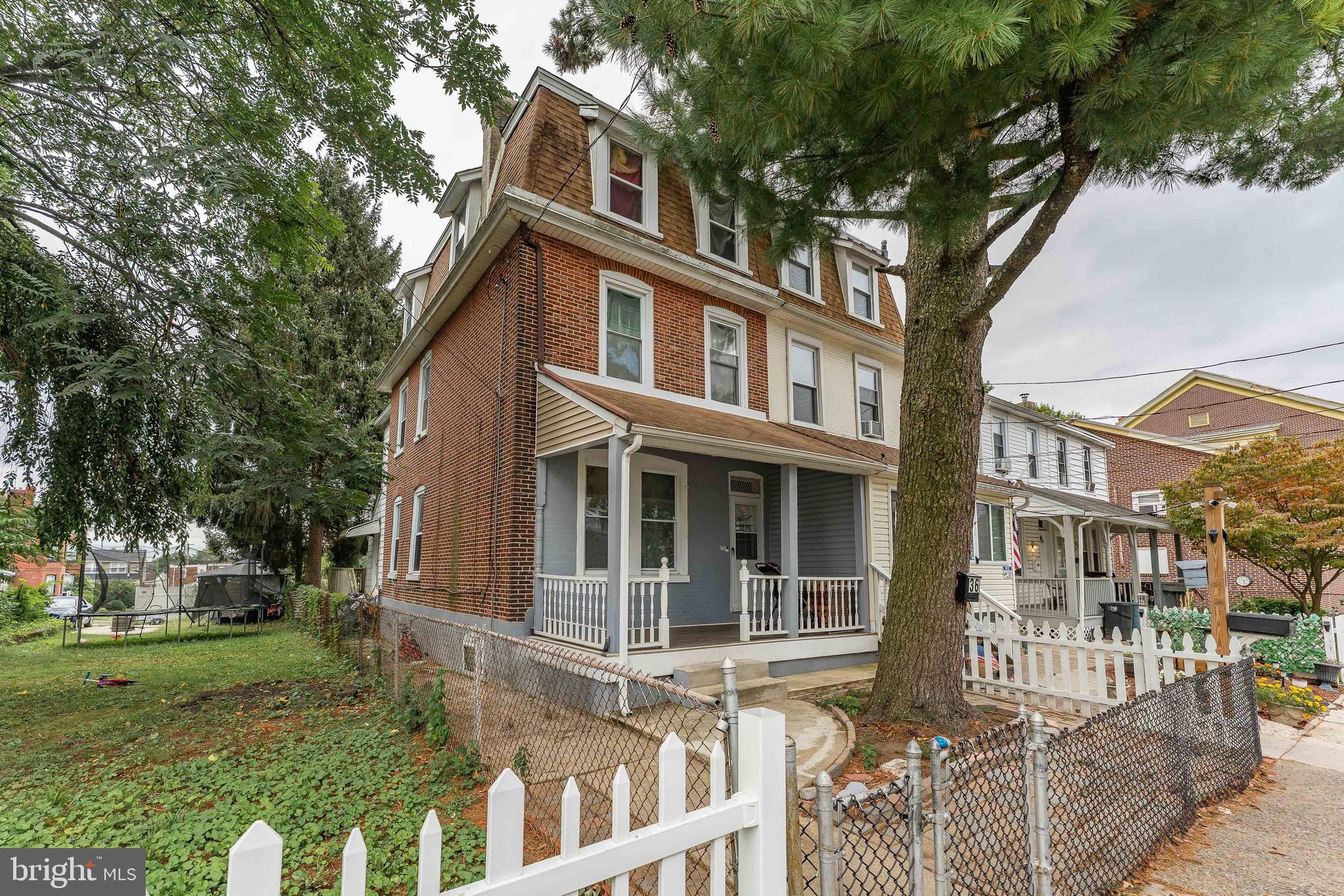 Welcome to 36 E Washington Avenue, a 5-bedroom, 1-bath twin home in the Primos Secane neighborhood of Clifton Heights. The exterior features a classic brick façade and a welcoming front porch. Inside, the living room offers luxury vinyl plank flooring, a ceiling fan with light, and a decorative mantle. The dining room continues the same flooring and ceiling fan, while the kitchen includes tile floors and overhead lighting. Upstairs, the second level features two bedrooms, a full bathroom with tile floors and a tub/shower combo, and the primary bedroom. The third level provides two additional bedrooms with carpet flooring and ceiling lights, ideal for a home office, playroom, or guest space. This home is conveniently located near shopping, restaurants, cafes, and entertainment, making it a great option for both comfort and convenience. Don’t miss the opportunity to make it yours!