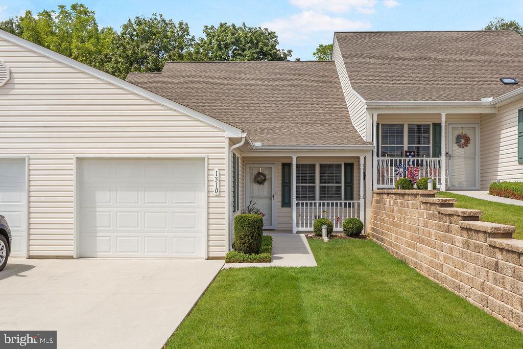Welcome to this pristine 2-bedroom, 2 FULL bath condo in Roth's Farm Village, Spring Grove. The brand-new gorgeous luxury vinyl plank flooring adds charm throughout the property. A master suite including a walk-in shower is equipped with grab bars for safety. The one car garage has room for storage and offers a ramp and grab bar into the home. Parking is plentiful for these units with room for two cars on the driveway, on street parking and a nearby parking lot for visitors. The covered front porch can be enjoyed for relaxation and/or meeting your neighbors. In the second bedroom is a double glass door leading to a patio. One of the highlights of this unit is having no units behind it, so you'll be able to view local wildlife. The current owner has enjoyed seeing foxes, squirrels, rabbits, birds and even a deer while taking advantage of this feature. Your condo fee includes lawn and snow maintenance, mulching, common area maintenance, and access to a community building. Windy Hill Senior Center is directly across Roth's Church Rd from the condos, and offers plenty of activities including exercise classes, art classes, speakers, bus trips and much more! It's a great place to get to know older, yet active friends. This is "not your grandma's senior center" The Spring Grove community has lots of other things to offer, including restaurants, a nearby library, shopping, rail trails, several community parks and it's close to York and Hanover for your other needs.