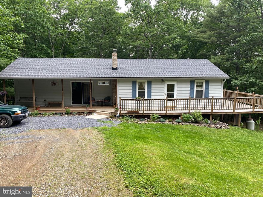 This charming 3 bed 2 bath rancher boasts a large main bedroom with walk-out porch access and attached full bathroom and closet. There have been many updates and replacements within the last two years including: roof, fridge, washer, and hot water heater, along with a chimney cleaning. The lower level provides plenty of finished living space, in addition to a 3 car garage with one garage door access. There is also a shed with electric on this expansive 1+ acre lot.