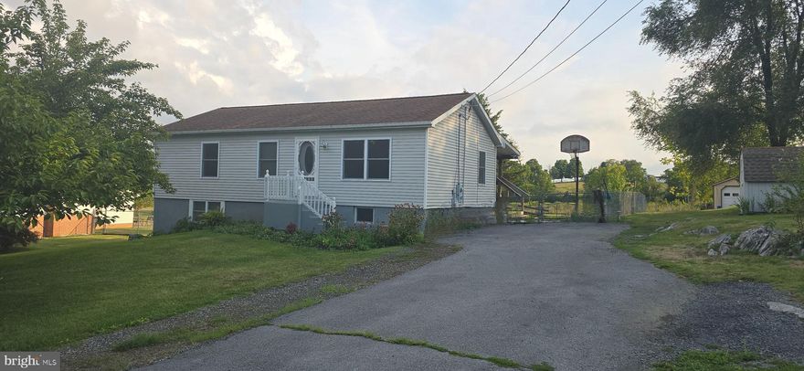 Introducing a charming raised ranch located on .93 acres that is canvas ready for your  personal touch.  Nestled in a delightful neighborhood on the  VA State line, this residence offers three bedrooms and two bath-the perfect retreat for relaxation  This home has new paint throughout the first floor, an updated  bathroom that was just renovated last year,  and  a water softener with reverse osmosis system.  Along with a   roof that was replaced in recent years,   it has one large  shed and  2 additional smaller sheds to handle all your storage needs. There is a large covered deck on the rear of the home that overlooks the partially fenced in  back yard. Step into the basement with endless possibilities for a game room or a fitness space.
            This home isn't about just the indoors, sitting on almost an acre  lot, it provides ample space for gardening enthusiasts or backyard barbecues. Close to the schools and shopping, this little gem could be yours  with a price point that won't break the bank. Whether you are a seasoned renovator or a first time home buyer, this house promises the freedom to create a space that truly feels like home. Ready to stamp your style on this special spot? This home will go quick. 
               I could go on and on, but you can't find another home at this price , that is ready to move in, with very little work to be done... The pictures will speak volumes. I will be updating the pictures as improvements are made.

Call today to set up an appointment.