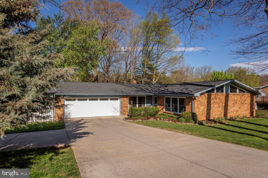 One-level home with detached flex space in Belmont Estates just minutes from city amenities! Inside, you'll find hardwood floors, crown molding, glass-paned doors, and a wood-burning fireplace. The kitchen has character: exposed brick, center island with cutting board, a Kraus sink, and built-in desk area with wooden shelving above. The dining room, living room with vaulted ceiling, den, sunroom (converted from screened porch in 2023), laundry room, half bath, generous owner's suite, and three additional bedrooms & 2nd full bath combine to make a very efficient and spacious floor plan. Outside, the fully finished detached "shed" (added in 2021) with a mini-split HVAC unit, LVP floors, recessed lighting, and a built-in desk opens up possibilities: a home office, creative space, you name it. There's also a 2-car garage, paver patio, fenced back yard, mature landscaping, and a backyard complete with a play set and playhouse. Roof replaced and fencing added in 2020, garage door and heat pump replaced and crawlspace encapsulated in 2024. It's the full package in a great location, with a little extra room to breathe!