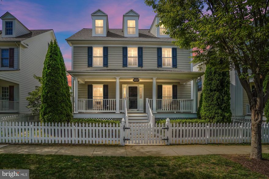 This lovely home in the Villages of Urbana has it all--including a white picket fence! Relax with your morning coffee on the spacious front porch or enjoy an evening beverage on the side porch or on the patio in the fenced yard. And the location doesn't get any better than this--situated on a quiet street across from a playground and just around the corner from schools, tennis and basketball courts and the great amenities of Urbana! You'll love the floorplan and amenities of this spacious home with four finished levels! With well thought-out spaces throughout--the main level includes a formal living room, expansive office/library, dining room and open floorplan gourmet kitchen and family room.  Upgrades galore--including plantation shutters, gleaming hardwood floors, a beautiful stacked stone floor-to-ceiling fireplace in the family room, chair rail, moldings and  granite and stainless appliances in the gourmet kitchen.  New carpet, too! The luxe owner's suite features a walk-in closet and bath with  separate shower and soaking tub. Two more second level bedrooms and a convenient laundry area.  All this, and a spacious upper level with endless possibilities--this light-filled bedroom has an ensuite bath, a walk-in closet and large storage area. The finished lower level features a full bath, storage area, and spacious recreation and living areas. Don't miss your opportunity to live in the Villages of Urbana--with its sought-after amenities, including two pools (including the resort-style pool with lazy river), work-out facility and Village Marketplace with restaurants, grocery and library!