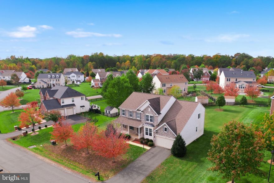 Hello New Home Seekers! I am excited to present to you an extraordinary property, nestled at the end of a tranquil cul-de-sac within the peaceful and elegant community of Hunter Ridge Estates. 

This exquisite home is one of only four Heath models in the entire (46) Home Hunter Ridge Estates community, making it a rare and highly sought-after opportunity. 

Situated on a spacious .50 acre lot, this residence offers an open-plan living space designed to provide unparalleled comfort and versatility. Inside, you will find five generously sized bedrooms and four and a half bathrooms, perfectly suited for daily living, entertaining, and unwinding in style. 

The home features a private home office, ideal for remote work or study, and a stunning family room highlighted by a floor-to-ceiling stone gas fireplace that creates a warm and inviting atmosphere. The gourmet kitchen is a chef’s dream, complete with granite countertops, a double oven, stainless steel appliances, and a large walk-in pantry. Adjacent to the kitchen, an open sunroom fills the home with natural light, enhancing the bright and airy feel throughout. Additional amenities include a practical mudroom with direct access to the two-car garage, providing convenience and organization. The luxurious primary suite offers a cozy fireplace, a spa-inspired en-suite bathroom with a soaking tub, separate walk-in closets, and a separate dual vanity setup to meet all your needs.

For entertainment and relaxation, the expansive media and recreational room provides a perfect space for fun and leisure activities. Additionally, the home will include free of charge, the 90” Top Shelf Air Hockey Table. This remarkable home truly offers so much more and is ready to become your perfect sanctuary. 

Situated just approximately a one-minute stroll from your doorstep, you will find the Howison Park Soccer Fields and Playgrounds, perfect for outdoor activities and enjoyment. For those connected to military life or seeking convenient access to major bases, this location offers excellent proximity: Fort Belvoir Army Base is within 18 miles, translating to a manageable 30-minute commute; Fort Myer Army Base and the Pentagon are within 30 miles, approximately a 45 to 50-minute drive. Additionally, Quantico, VA lies just 12 miles away, with Andrews Air Force Base within 38 miles—all easily accessible via the I-95 E-Z Pass Express Lanes, allowing for faster commutes and the ability to bypass traffic congestion effectively.

For shopping enthusiasts, the Potomac Mills super shopping center is only about 5 miles away. This outlet mall boasts over 200 well-known factory outlet stores alongside a diverse array of restaurants and eateries, catering to a wide variety of tastes and preferences.

Nature lovers and recreation seekers will appreciate the close proximity to Prince William Forest Park, offering 37 miles of scenic walking trails, as well as the Dale City Recreation Center, which features an indoor pool and exercise facilities to support a healthy lifestyle.