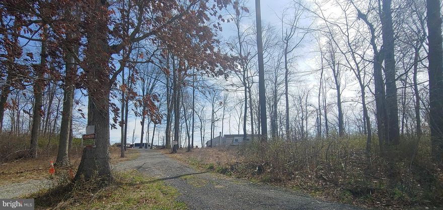 Check out this detached rancher on 2 acres tucked into the Chester County countryside. The location offers easy access to major routes to Philly, Delaware and Maryland. The house features 3 bedrooms and 1 bathroom. There are a rear screened porch and larger detached garage. Rehab the current structure or start fresh and build it your way.****** “Property accessed via shared farm lane. Easement/right‑of‑way may exist. Buyer to verify during due diligence.”