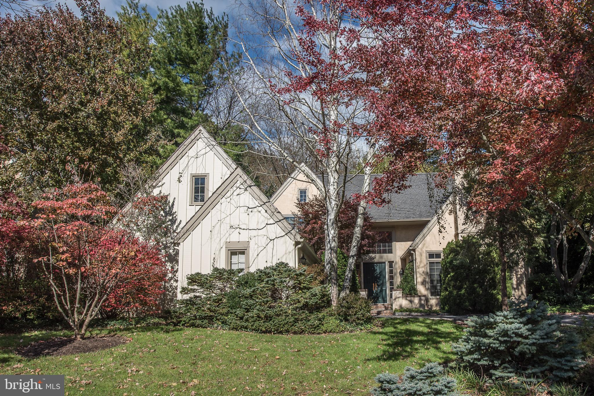 It is no secret that Denbigh remains a very popular and sought after enclave among Buyers today seeking a tranquil, natural setting with gently sloping meadows, a winding stream and beautiful mature trees, walking paths and no through traffic. A private and almost secluded sanctuary in which to live, among just a few others. Its 19087 location allows for very easy and efficient access to almost everything one may want or need - a major convenience today. The Upper Merion Township location provides welcome relief from higher, adjacent property tax assessments. Welcome to 1229 Denbigh Lane, a Brighton model, with a premium, inner circle lot location for commanding views to the front, backing to open space for easy access to the grounds and trails, to peace and privacy, just out the back door. The private courtyard driveway allows for an oversized, attached, side set, two car plus garage. This fantastic Brighton floorplan has become a classic - well lit, with a slightly formal bearing, with great space allocations, but allowing for casual and easy, day-to-day living w excellent flows. Exceptional natural lighting with abundant sunshine, and easy access to the out of doors. The amenities abound. Two story entrance foyer with large, south facing transom window. Double entrance doors, hardwood floors throughout the first floor, a library/den with built ins and a stone fireplace. Two story family room is immediately adjacent, open to the kitchen and breakfast room, and offers oversize sliding doors to the large, rear patio, and a stone fireplace hearth and floor to ceiling stone accent wall. White on white kitchen has breakfast area and counter seating. Oversize bluestone rear patio has a little pond and fountain, and glass doors to access to the Dining room, Family room and a gate to the meadow and walking path at the rear. Step down Living room has third stone fireplace, good scale and great windows, and opens completely to Dining room and Foyer. Stairs to the second floor, with open landing and three bedrooms, each with very large closets, two and one half bathrooms. Owner's bedroom suite has pretty windows, double doors, dual walk-in closets, soaking tub, private WC and stall shower en suite. The first floor laundry room has transom mudroom with storage and coat closets, and interior access to heated, two car attached garage. The full, unfinished lower level has excellent storage capacity and potential to further finish, with a workshop, a fitness room and a cedar closet. The very well run HOA attends to all of the landscaping, plowing and maintenance work necessary to keep both the house and community in top notch shape. If easy and elegant living in a parklike environs appeals to you, please come and see this great opportunity at 1229 Denbigh Lane.