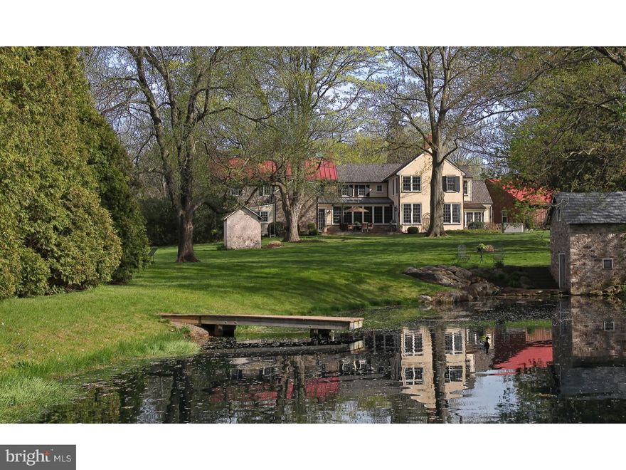 Breathtaking views await at historic Wethersfield Farm, where master craftsmanship & visionary design have integrated modern amenities with old world charm. A tree-lined drive leads to the c.1812 stone manor farmhouse, recognized by Heritage Conservancy, which has been enhanced & expanded over 6,000 sq.ft. through combined efforts of renowned architect Lynn Taylor and Mack & Roedel Custom Builders. Working fireplaces, built-in cabinetry, and original hand blown windows decorate the entrance parlor & main living room, while random width Cherry floors blend seamlessly with the original oak & pumpkin pine. 5 fireplaces and exposed stone walls add to the charm & understated elegance. The summer kitchen with a walk-in fireplace now serves as the game room. Welcome guests with a private 1st floor en-suite. Hand hewn beams salvaged from a local barn frame the family room with a 10' ceiling, stone fireplace flanked by window seating & views of the light dancing off the spring fed pond. The open concept dining room affords the heart of the home with a backdrop of panoramic views of the windmill & pastures. No expense was spared in the gourmet kitchen crafted by William Draper with state of the art appliances. Plenty of seating around the Cherry island with a marble baking station & prep sink. A mudroom with built-in cubbies & utility sink are steps away from the oversized 2-car Kistler barn/garage. A powder room is located near the side entrance, where a hottub hosts sunset views. The upstairs has a laundry room, main bedroom with built-in window seats, dressing area, and 4 closets. The master bathroom boasts marble tile, a steam shower, & soaking tub. A 2nd bedroom has its own bathroom, and 2 more bedrooms share a hall bathroom. Another room with a fireplace may be used as another guest room or study. The lower level has exposed stone, 10' ceilings, a full bathroom, an office, 2 sets of stairs & a full window allowing natural light to give this space great versatility. A Bluestone terrace overlooks the property dappled with reminders of its past, like the spring house now updated with electric & the smoke house. Barn/tractor shed has extra storage & a gated stall in the fenced pasture. Also 1-car garage & a chicken coop. Abutting Covered Bridge Park this property is a gem unto itself, but add the location (3 miles to Doylestown Boro), award-winning school district, proximity to hospital, train, fine dining & shopping ? and welcome to your own pocket of paradise.