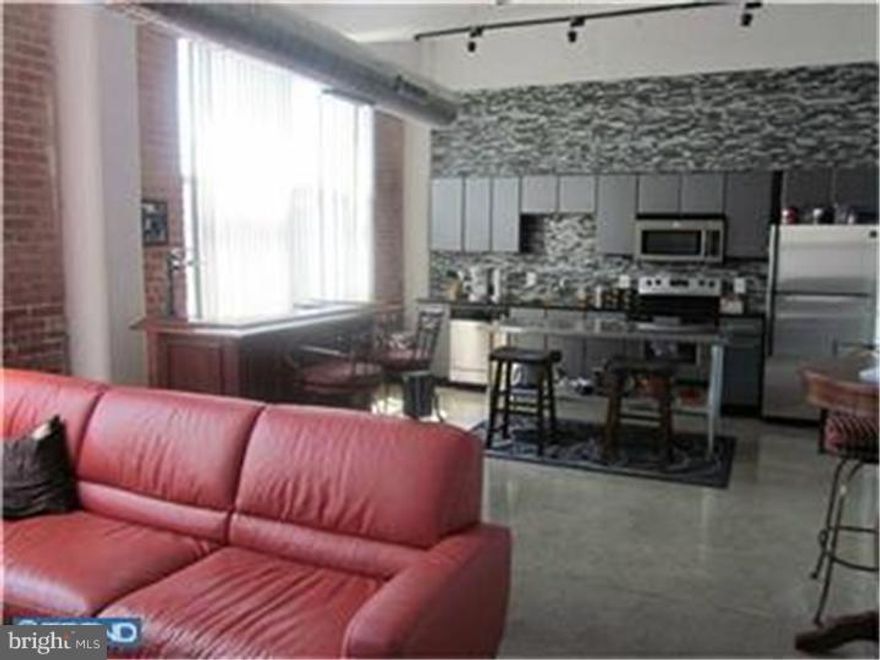 Industrial NY Loft Style Condo. Includes a parking space in our gated lot, access to an 8000 sq ft fitness center, 24/7 front desk personnel & on-site maintenance. 444 Lofts is a true warehouse conversion featuring polished concrete floors and concrete beamed ceilings for a contemporary look. Kitchens feature sleek black granite counters & stainless steel appliances (DW, GD, Microwave). Stacked washer/dryer. Generous closet space. HVAC, high speed net/cable access. This unit features Large floor to ceiling windows with lots of light, 1 bedroom, 2 Juliette Balconies, and views of the river. Pictures are of similar units.