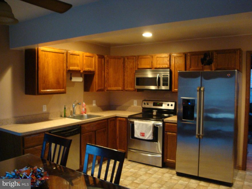 100% financing for qualified Buyers! Brick home w 2800' of living space. Remodeled kitchen, SS appliances & breakfast bar. Hardwood & carpet floors. 4 BRs and 2 Bathrooms upstairs. Finished Basement with large family room, Office/possible 5th BR, Full Bathroom utility & storage rooms. 4 Car Detached Garage w HVAC, fenced, flat lot, paved driveway & 2 sheds. Close to Waldorf, LaPlata, Naval Bases.