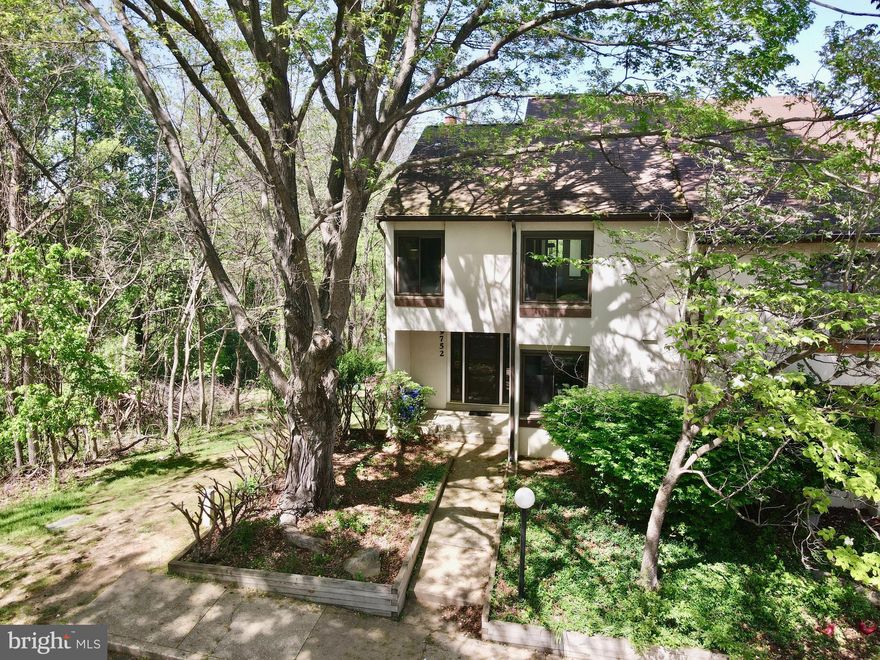 **Check out the video tour** A little elbow grease and it'll stand above all! Welcome to this beautifully situated end-unit townhome, nestled on a picturesque lot with serene tree-lined views to the side and open space at the rear offering the perfect blend of privacy and natural beauty. Step outside to a spacious rear deck, ideal for entertaining or simply enjoying the peaceful surroundings. Inside, the main level features a generous kitchen with ample counter space, a cozy breakfast nook, a formal dining area, and a sun-filled living room anchored by a charming wood-burning fireplace. A convenient half bath completes the main floor.  Upstairs, the expansive primary bedroom currently configured as one oversized suite can easily be converted back into two separate bedrooms, and includes an attached full bath. Two additional bedrooms and a second full bath offer plenty of space for family or guests.  The finished lower level boasts a large recreation room, a walk-in closet, a half bath with potential to be converted into a full, and an unfinished area with a workshop, storage space, and laundry area perfect for hobbies or future expansion.  Parking is a breeze with one assigned spot and several overflow spaces conveniently located right out front. Just minutes away from all the vibrant offerings of the Columbia Mall area, including The Mall in Columbia’s upscale shopping, diverse dining options like The Cheesecake Factory and Seasons 52, entertainment at AMC Theatres, and nearby outdoor escapes like Lake Kittamaqundi and Merriweather Post Pavilion. Don’t miss this rare opportunity to enjoy comfort, convenience, and community in a beautiful Columbia location!