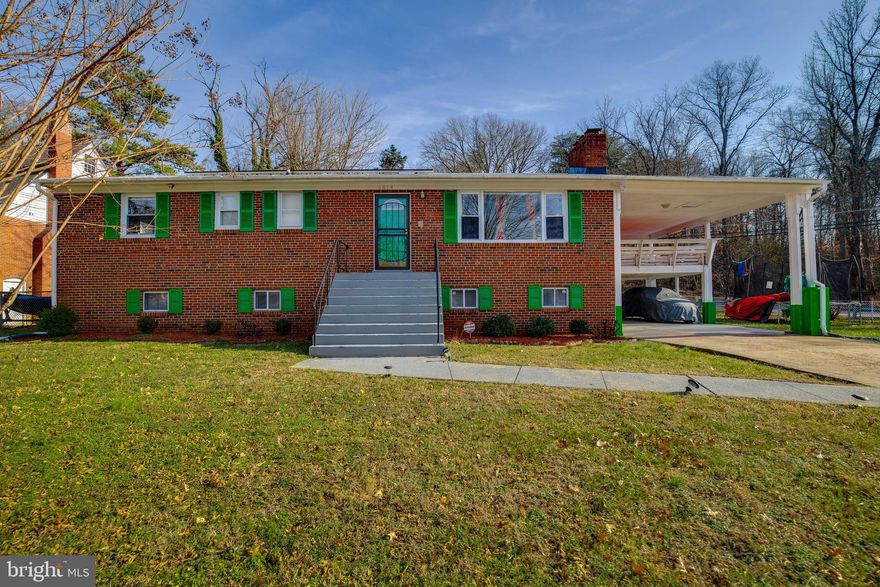 A lovely home with 5 bedrooms and 3 full bathrooms, including  a master suite with a  full bath.  Stainless steel appliances and hardware flooring throughout most of the first level of the home. Basement is huge with two additional rooms.  Plenty of parking for at least 4 cars with Carport and long driveway.  As a bonus, a finished huge deck right off the kitchen exit and directly above the carport.  Home has been well maintained by the owner and will meet all of your needs. Now just awaiting a new owner!