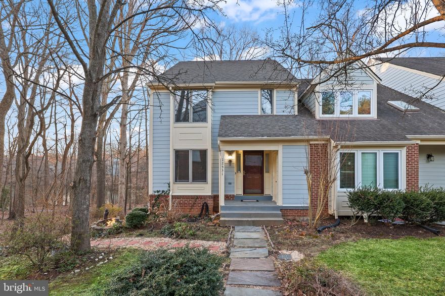 Perfectly set lakefront end-unit townhome, located in a small enclave of contemporary townhomes in the Fair Lakes community. This 4 bedroom, 3.5 bath townhome offers convenience of commuting, all while being able to return home to a peaceful park-like setting with huge windows and views of Lake Zasada. The exterior features a covered front entrance, deck off the family room, pathway to the lower level's separate entrance to the in-law suite, covered patio, and a detached garage plus one assigned space.

Upon entering, there are views straight back to the lake. The sunlit main level features hardwood floors in the dining and sunken living room, recessed lighting, and an open floor plan that seamlessly connects the space. The kitchen has a convenient pass-through to the formal dining room which is complemented by triple picture windows that flood the space with natural light. A powder room with a pedestal sink completes this level.

Upstairs, you'll find three generously sized bedrooms, including a primary suite with an ensuite bathroom and ample closet space. A full hallway bathroom serves the two additional bedrooms, one of which is currently set up as a home office with the same huge picture windows that mimic the set on the main floor. This unique extra feature is due to the house being an end unit.

The fully finished walk-out basement offers incredible versatility with a private in-law suite, complete with a kitchenette, den, separate combo laundry, and access to the covered patio. Water heater updated in 2020, upstairs refrigerator in 2021, laundry washing machine in 2021, and combo washer/dryer in 2022.

Enjoy the community's many amenities, including nature trails, tennis courts, tot lots, and access to Lake Zasada. Conveniently located near I-66, Fairfax County Parkway, Routes 29 and 50, Metro, Whole Foods, Costco, Fair Oaks Mall and so much more.