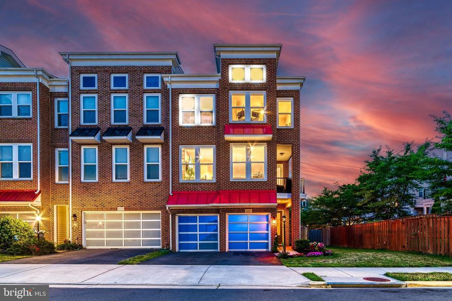 Beautiful end unit luxury townhome boasting four bedrooms, three full and two half bathrooms, plus a two car garage!  Lovely light filled open layout with gleaming hardwood floors and an incredible gourmet kitchen, this home is sure to please!  The kitchen features an extended island, granite counters, stainless steel appliances and modern pendant lighting.  Enjoy the outdoors on the rear deck, lower patio, or side balcony.  Upstairs you'll find the massive primary suite which offers two walk in closets with custom built storage features and a beautiful spa-like bathroom tucked away behind a space-saving barn-style door.  The additional bedrooms are generously sized and the laundry room is conveniently located on this bedroom level.   The entry level includes a spacious family room with a gas fireplace, as well as a bedroom and full bathroom.  Just minutes to Brambleton Town Center, pools, major commuting routes.  Come experience life in this sought after community! Welcome Home!