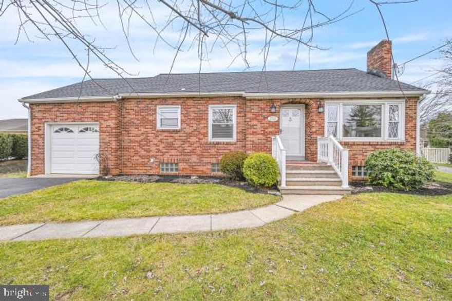 Cute as a button and ready for its new buyer.  This 2 bedroom, 1 full bath home has so many nice features.  Outside is brick with a new roof in 2023, new exterior lighting and new railings. Walk in the front door and you will find beautiful refinished hardwood floors throughout. Living room is large and features a brick wood burning fireplace with a mantel & lighting.  Kitchen & bath feature luxury vinyl plank floor - all new. Everything in the kitchen is new excluding the top cabinets, but the bottom cabinets are new along with the counters, refrigerator, stove and double bowl sink.   Separate dining room w/hardwood floors. The bathroom is totally refurbished with new appliances and faucets. Two nice size bedrooms with closets. A 5'x 11' mudroom leads to the level yard that features a shed and outdoor fireplace.  Lower level has a separate laundry room with a washer, dryer & laundry tub and systems room that measures 13' x 42'. And don't forget the 12 x 34 unfinished attic. Entrance to the attic is thru the garage.  Perfect location near I83 & Route 30, grocery stores, restaurants  & shopping areas.  You can't ask for anything else, ready to move into with no work for you.  Take a look, you'll be happy you did!