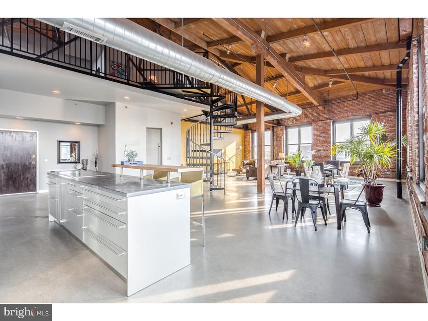Welcome to this rarely offered, top corner penthouse loft in the historic Cigar Factory located in Philadelphia's beloved Northern Liberties. This gorgeous, Southwest top corner unit showcases exposed, heavy timber, steel and brick construction along with poured and polished concrete and bamboo flooring throughout. This loft is bathed with sunlight by one complete wall of windows which continues through the corner and offers spectacular and uncompromised views of the city. The open floor plan offers seamless and uncluttered living. The custom kitchen by Bulthaup features Miele dishwasher, ovens and espresso/coffee machine. Sub-Zero fridge and a Wolf flat top cook top layered on top of beautiful black /grey marble island. Beautiful bedroom with built in custom closets and master bath appointments by Phillip Starck/Duravit, Grohe fixtures, more Bulthaup cabinetry and gorgeous custom built wood vanities. This bi-level loft offers impeccable loft space that can be used for office space and/or another bedroom area. You will appreciate the vaulted ceilings equipped with skylights in this useful space overlooking this massive flat. This is a one of a kind display of craftsmanship that brings old and new together perfectly. The best of everything, not to mention 1 car-deeded garage parking. We welcome your visit today!