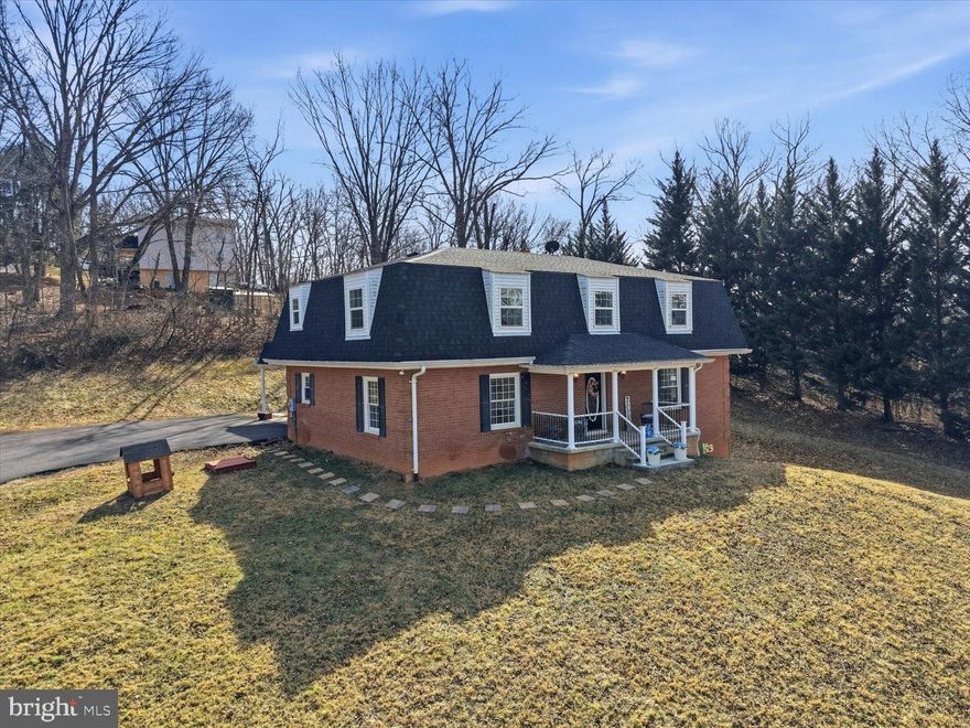 Own this Shenandoah Chateau with 5 bd/2.5 ba,  a walkout basement and 3 fireplaces with over 3,000 ft. of new renovations.   Nearby find the Shenandoah river front, parks, historic downtown, cafes,  shops and churches just steps away.  With seasonal mountain views, relax on your front porch.  As you enter this entertainment haven, feel the light filled formal living room with newly refinished hardwood floors.   Host great dinner parties in the formal dining room and gourmet kitchen with high-end counters, floating shelves and new backsplash.  At the back door, enjoy your outdoor living area for more dining options.   Beyond the newly renovated kitchen,  a cozy family room features a fireplace (double-sided) with a wood-burning stove for added warmth and charm. A sunroom with its fireplace offers a quiet retreat for year-round relaxation.   Upstairs, enter the spacious primary suite with a walk-in elegant tile shower and a double vanity, creating a spa-like experience! There are 4 more spacious bedrooms with views and a full bath.     Also on this level, enjoy the convenience of  all-in-one washer/dryer.  (There is an additional laundry in the walk-out lower level.) Downstairs, in the basement, find a potential den, home office, gym, or guest space. Additionally, there is extra space for storage or to customize as you wish, along with a wood-burning fireplace and a wood stove. (Half Bath rough in as well! )  Schedule your Shenandoah Chateau Tour today.    Live:  Sat, 2/28