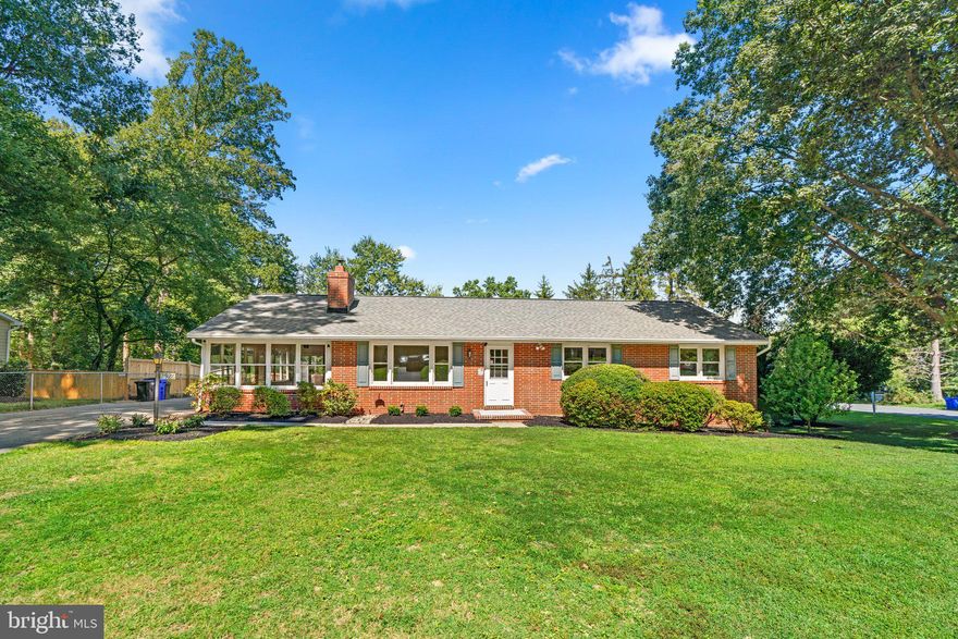 Situated in a cul-de-sac on a .46 acre homesite backing to woods in Bethgate is this light-filled rancher with a scenic pond view. A charming entry presents this immaculate home featuring enriched hardwoods, a formal living room with a wood burning fireplace and a picture window, followed by a dining room accented by crown molding and chair rail trim. With plenty of room to create culinary masterpieces, the upgraded kitchen displays classic white cabinetry, quartz counters, stainless steel appliances, and access to a family room highlighted by walls of windows, easy to maintain wood laminate flooring, a modern  flair ceiling fan, sliders opening to a deck and backyard, and a second walkout to the driveway. Providing ample room to grow, the lower level with walkout offers the flexibility to customize based on your tastes and desires, and includes a rec room with LVT flooring, 2 bonus rooms, extra storage, a full bath, and easy access to a patio with a hot tub and 2 sheds overlooking the fenced backyard.