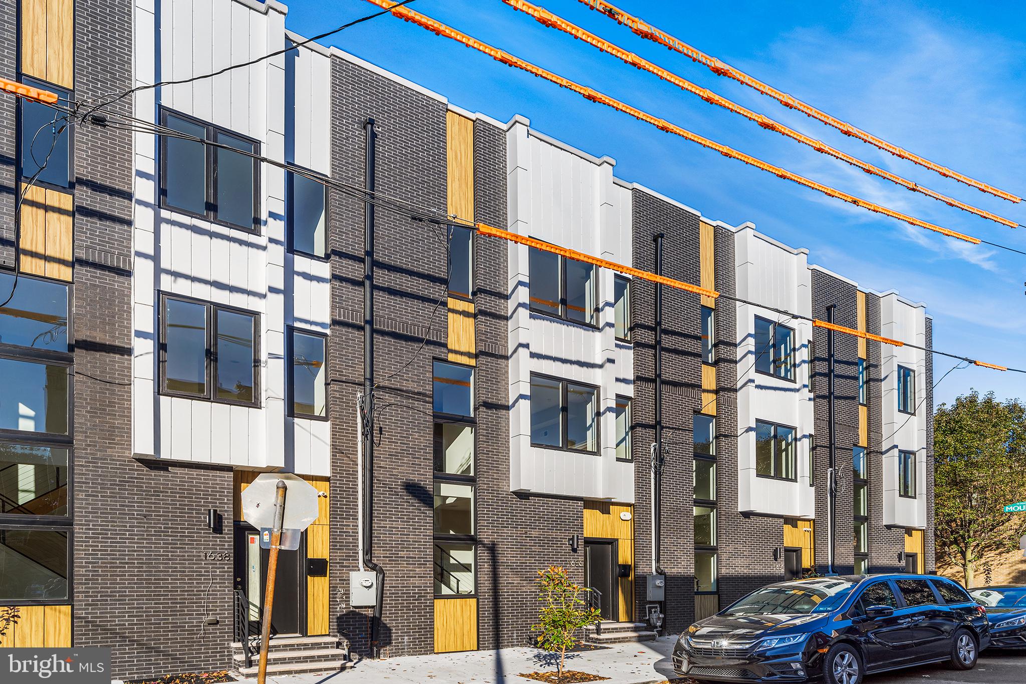Located in the lively Pennsport neighborhood of Philadelphia, 1632-1638 S 2nd Street presents a collection of four contemporary luxury townhomes thoughtfully designed for modern living. These brand-new residences, built by one of the city's premier developers, showcase meticulous craftsmanship and attention to detail throughout. Each home spans over 2,400 square feet, offering 4 generously sized bedrooms, 4 full bathrooms, a finished basement, and a spacious 2-car garage complete with Tesla charging capabilities.
Upon entry, the towering exteriors lead into light-filled foyers with direct access to the garages via rear entrances. The heart of each home lies on the main level, where sleek, open-concept layouts are accentuated by hardwood floors, oversized windows, and recessed lighting. At their centers, modern chef's kitchens boast high-end Bosch stainless steel appliances, substantial islands with seating, and custom cabinetry complemented by striking green subway tile backsplashes. Adjacent, the dining areas and living rooms open to private terraces, creating inviting indoor-outdoor flow. On the upper levels, the homes continue to impress with thoughtfully designed spaces.
The primary suites, located at the rear of the third floors, feature private terraces, expansive walk-in closets, and spa inspired bathrooms outfitted with soaking tubs, glass-enclosed showers, and double vanities. Additional bedrooms, each with ample light and en-suite bathrooms, provide flexibility for guests or growing families. The finished basements expand the living spaces further, ideal for media rooms, home gyms, or offices. Finally, rooftop decks crown these exceptional homes, offering panoramic skyline views perfect for entertaining or quiet reflection.
Located steps from Dickinson Square Park, with its farmer's market and recreational facilities, these homes are surrounded by conveniences. Neighborhood favorites like Grindcore House and Moonshine Philly are just a short walk away, while essential retail destinations like Target, Acme, and Ikea are minutes from your door. With easy access to public transit, major highways, and South Jersey, this collection at 1632-1638 S 2nd Street blends modern luxury with urban convenience.
All units are currently rented. Additional information available on request.