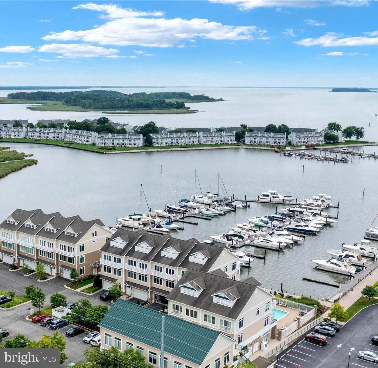 Luxury Waterfront Living in the Heart of the Kent Narrows! Experience resort-style living on Maryland’s Eastern Shore in this exquisite three story end unit townhome, ideally situated in a prime Kent Narrows location. Offering breathtaking water views from all three private decks, this home blends elegance, convenience, and coastal charm. Step inside to find a bright, open concept main level featuring a spacious living area, a well-appointed kitchen, a full bathroom, and a versatile third bedroom or home office. A private elevator provides easy access to all three floors, ensuring comfort and accessibility. The second level offers two expansive en-suite bedrooms, each with its own full bath, perfect for privacy and relaxation. The top level is an entertainer’s dream featuring a large flex space with a wet bar, wine refrigerator, and a full bath. Ideal for a guest suite, media room, or home gym. The possibilities are endless. Additional features include:
*Move-in ready condition
*Optional furniture conveyance (excluding select staging items)
*Community pool, marina, and included boat slip!
*Outside storage closet
*Walkability to waterfront restaurants and boutique shopping.
Don’t miss this rare opportunity to own a turnkey WATERFRONT Townhome with all the amenities of Luxury COASTAL LIVING! Schedule your private showing today!