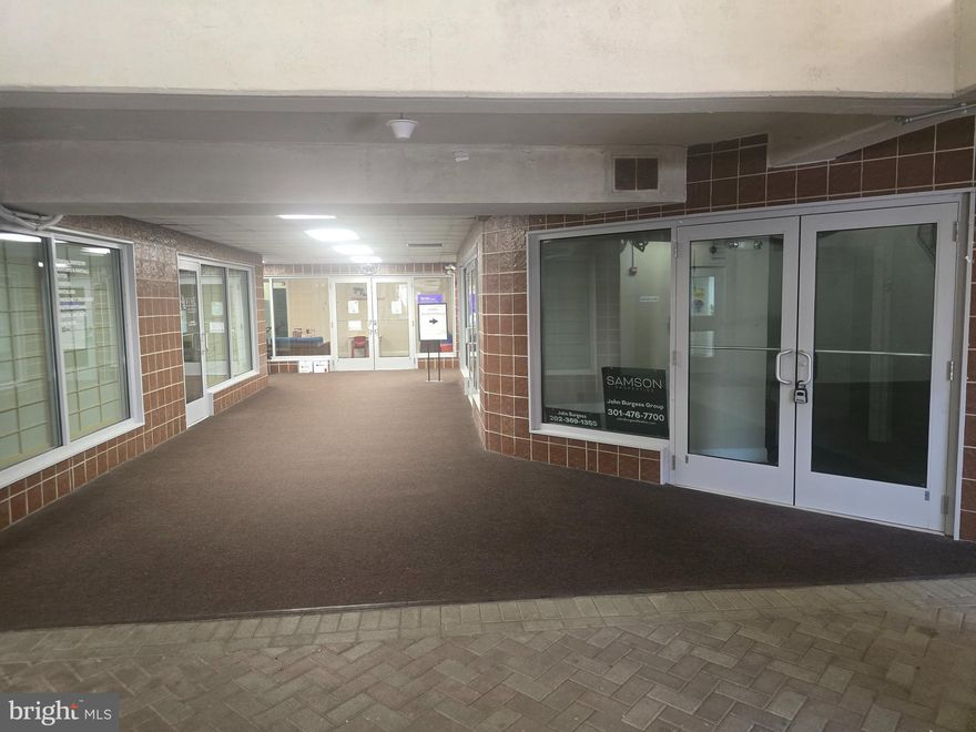 Two separate units suitable for office and/or retail use are being sold together. The combined 1,248 SF interior includes: glass door entry, reception area with built-in desk and counter, 6–7 private offices, a kitchenette/breakroom, and 2.5 bathrooms. The units feature recessed lighting,  florescent lighting, built-in shelving, bookcases, file cabinets and carpet flooring. This sale includes two dedicated garage spaces (taxed separately), provided as one space per unit.