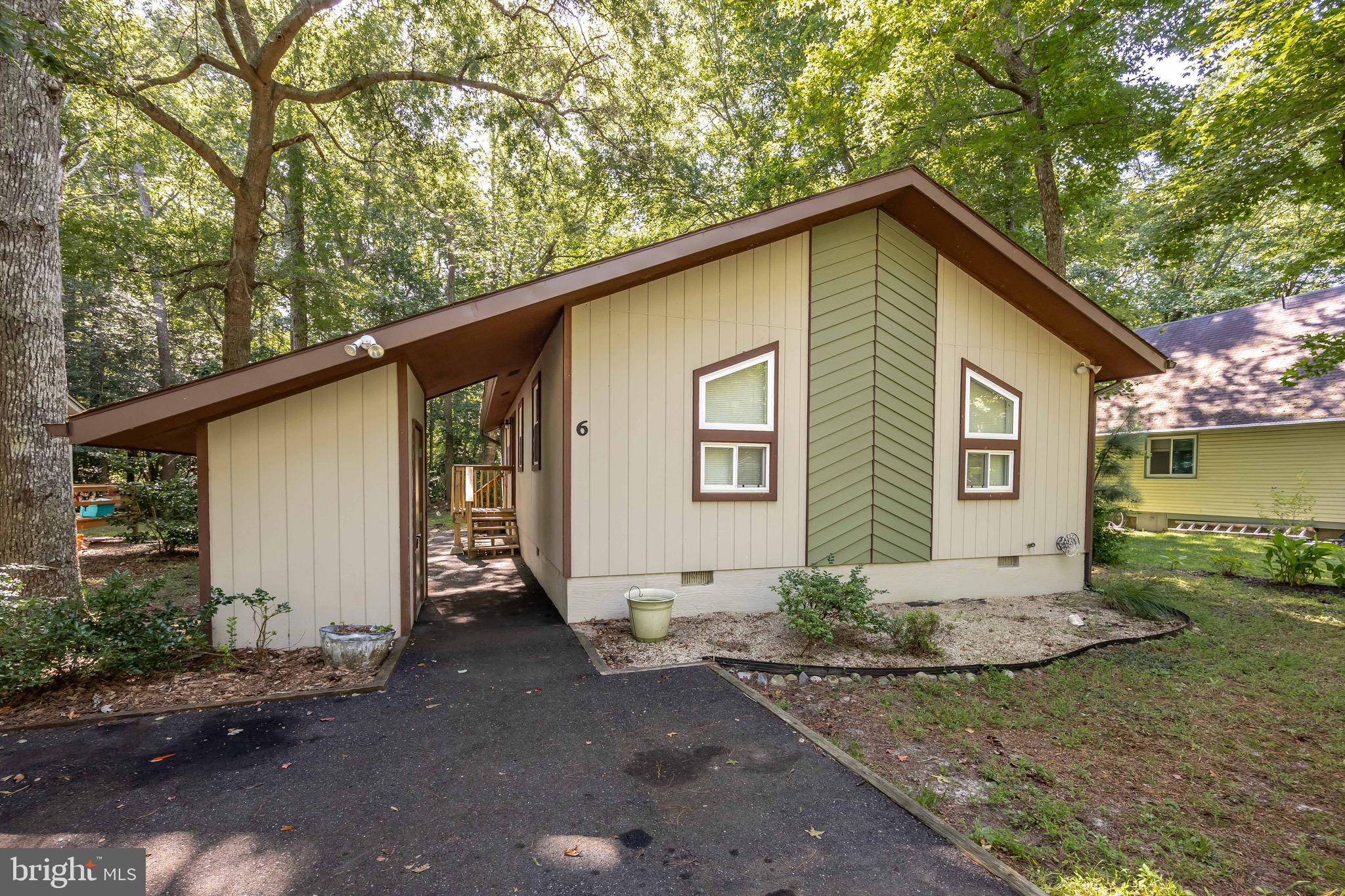 Welcome to 6 Brandywine Drive. This charming home is located in the heart of Ocean Pines, just minutes from the Ocean City beach. Inside you will find an open living area with vaulted ceilings, a wood burning fireplace, a kitchen with new stainless steel appliances and a screen-in porch. With so much potential to be your next home or rental property, this 3 bedroom, 2 bath home is ready for its next journey.