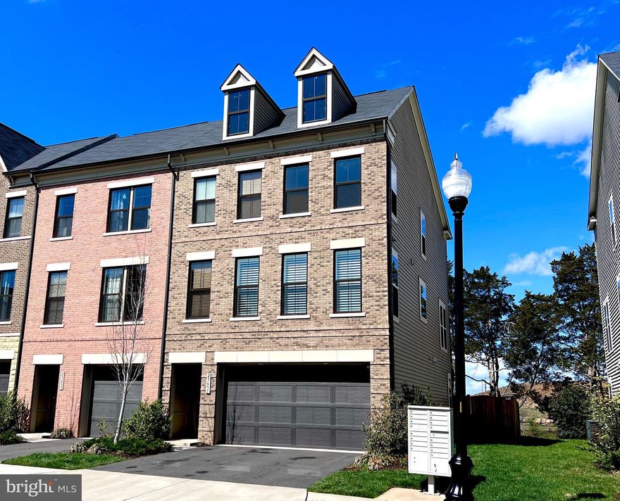 ******OFFER DEADLINE 3PM April 10, PLEASE SUBMIT HIGHEST & BEST BY THIS TIME*****Stunning end-unit town home in Brambleton! The home sits on a premium lot backing to trees with an oversized, fenced backyard. An open concept main level boasts a gourmet kitchen overlooking the family room. High-end finishes in the kitchen include an oversized island, upgraded white cabinetry, stainless steel appliances with custom hood vent. The expansive family room has a gorgeous stone fireplace & lush green views of private lot. On the upper level is the primary suite with tray ceiling & spa bathroom with upgraded tile. Two additional bedrooms, full bathroom & laundry room complete this level. New LVP flooring in the walk-out basement, an additional entertaining space. Relax on your private covered porch or patio. Plantation shutters, irrigation system, epoxied garage flooring & Pottery Barn finishes, this home has it all! Brambleton features tons of amenities... HOA fee INCLUDES FIOS Internet & cable. There are four pools and fields, walking trails & a wonderful library. The town center is just minutes away with restaurants, shopping and movies.