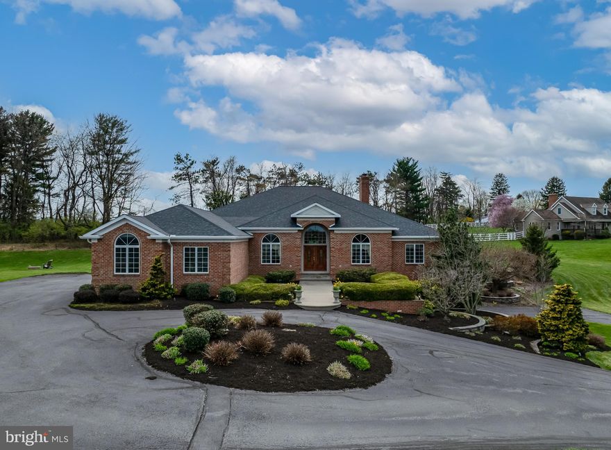 A Rare Gem in the Wilson School District — Luxury, Space, and Unmatched Elegance.
Spectacular all-brick ranch home, offering over 6,100 square feet of beautifully finished living space and nestled on nearly 3 pristine acres in the coveted Wilson School District.
From the moment you turn down the pine tree-lined drive, this property impresses with professional landscaping, a walled front terrace, and a private backyard oasis featuring an in-ground pool and covered flagstone patio—perfect for year-round entertaining.
Inside, the home stuns with architectural elegance and thoughtful design. Step into the grand foyer, through double front doors, flanked by formal living and dining rooms and continue into the Great Room with a soaring 12-foot tray ceiling, recessed lighting, double sliders to the rear covered patio and a striking stone fireplace with beautiful mantle.  The open layout creates a seamless flow that’s both sophisticated and welcoming.
The heart of the home is the custom kitchen, fully equipped with quality stainless appliances, such as a built-in Miele coffee maker, Viking fridge and double oven and a Bosch dishwasher.  With quartz counters, large skylight , breakfast bar and a spacious eat-in area that opens directly to the outdoor living space and overlooks the pool, this is the perfect chef’s kitchen.
The right wing of the home features an en suite bedroom and two additional generously sized bedrooms with a full bath and marble countertops.
The primary suite is a true retreat, offering direct access to the pool and garden area, blending indoor comfort with outdoor serenity.  A large soaking tub, marble counters, large vanity and spacious walk-in closet are sure to please.  The mud room has access to the back yard and has a convenient sink and storage space.
Downstairs, the finished lower level offers over 2,000 square feet of entertainment and recreation space. Enjoy a custom bar and billard area with pool table, a spacious entertainment room with gas fireplace, a private exercise room, and convenient walk-out access. A fourth garage, complete with workshop and equipment storage, completes this level.
Additional features include an oversized 3-car main level garage with attic storage, surround sound system, new roof in 2022 with owned solar panels and two new HVAC units in 2024. 
This home truly must be seen to be fully appreciated. With its stunning architecture, resort-like outdoor spaces, and expansive layout, it’s more than a house—it’s a lifestyle.