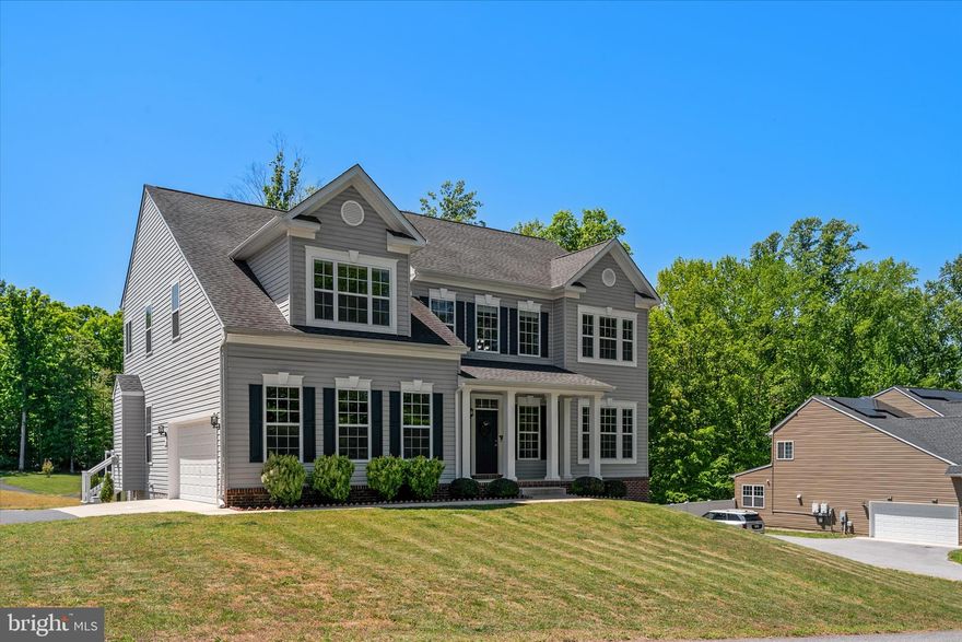 3202 Elwood Lane is a CUSTOM MASTERPIECE in the highly sought after Marley Run Community, offering nearly 5,000 square feet of refined, modern living. The journey begins in a soaring two-story foyer where natural light highlights the engineered HARDWOOD floors that flow across the main and upper levels. This floor plan is designed for versatility, featuring a main-level 3/4 bath with a custom-tiled shower and a flexible front room ideal for a home office, playroom, or formal dining. The home’s true centerpiece is the massive 30x25-foot gourmet kitchen, a culinary sanctuary equipped with a reverse osmosis water system, wine refrigerator, walk-in pantry, and MASSIVE GRANITE-TOPPED ISLAND AND PENINSULA, each offering added space for eat-in dining. The spacious window-draped morning room that adjoins the kitchen leads outside to a premium composite deck. Rounding out the open-concept main level is a sun-drenched family room anchored by a 36-inch gas fireplace with a slate surround.
 
Upstairs, the luxury continues in the EXPANSIVE OWNER’S SUITE, which offers a private sitting area, deep walk-in closet and a SPA-INSPIRED BATH featuring an oversized 5x5-foot dual-head shower, soaking tub, and split sinks. Just outside the primary bedroom is an optimally-placed laundry room complete with a utility sink and linen closet. Three additional bedrooms await upstairs alongside a beautiful full bath with a double sink vanity. The walk-out lower level is an ENTERTAINER’S DREAM, finished with durable luxury vinyl plank flooring. It features a dedicated home gym, large wet bar, family room, and a private fifth bedroom suite with an attached bathroom and yet another custom-tiled shower, making it ideal for multi-generational living or extended guests.
 
This house is as efficient as it is elegant offering a seamless blend of sophistication, comfort, and elevated everyday living. With SELLER-OWNED SOLAR PANELS and a FULLY PREPAID FRONT FOOT FEE, the home offers THOUSANDS of dollars in immediate and long-term savings. Technical upgrades abound, including NINE-FOOT CEILINGS ON ALL LEVELS, hardwired ethernet in every room and on the deck, and a 240-volt EV charging station in the garage. Positioned within a top-ranking school district with effortless access to commuter routes 2 and 4, this property provides a rare combination of high-tech infrastructure and modern style. Seller holds an incredible 2.75% ASSUMABLE VA LOAN with a transfer of eligibility for significant savings!