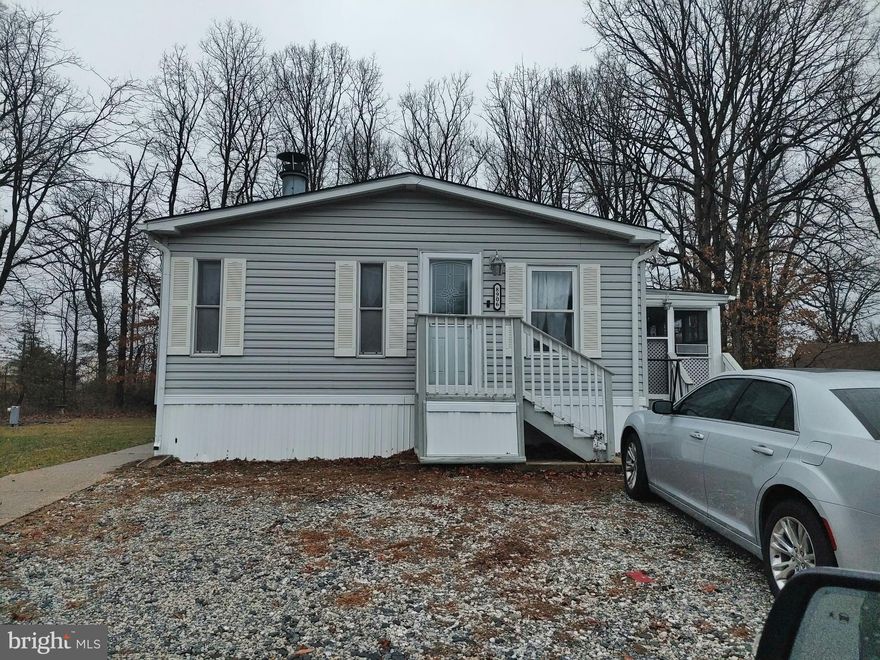 Come see this 3 bedrooms home with 2 full bathrooms, Lots of room to move around in.  Has a large rear screened in back pouch which leads out to a very large back year.   This homes has had the siding and roof replaced within the last 5 years.  This home is in a very quite community of Flower Village, which is closed to shopping, restaurants and schools and major road ways.  The mobile home park offers a large playground, basketball, soccer field, extra storage area.