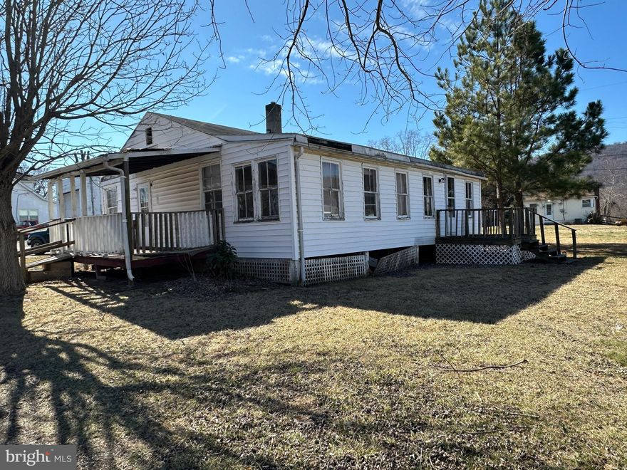 HOW BIG IS YOUR TOOLBOX? HOW HANDY ARE YOU? BIG TOOLBOX AND EXPERIENCED HANDYMAN NEEDED FOR THIS PROJECT......COMPLETE FIXER UPPER ON NICE DOUBLE LOT, WITHIN SITE OF NEW ELEMENTARY SCHOOL. BASICALLY, YOU'RE BUYING A SHELL.....FLOORS AREN'T BAD, ROOF ONLY APPEARS TO LEAK IN BACK ROOM, VINYL SIDING. THIS HOUSE IS NOT LIVABLE, USE CAUTION WHEN ENTERING. CASH OR CONVENTIONAL LOAN THROUGH LOCAL BANK ONLY! CONVEYS "AS IS" WHAT YOU SEE IS WHAT YOU GET, OWNER WILL MAKE NO REPAIRS.