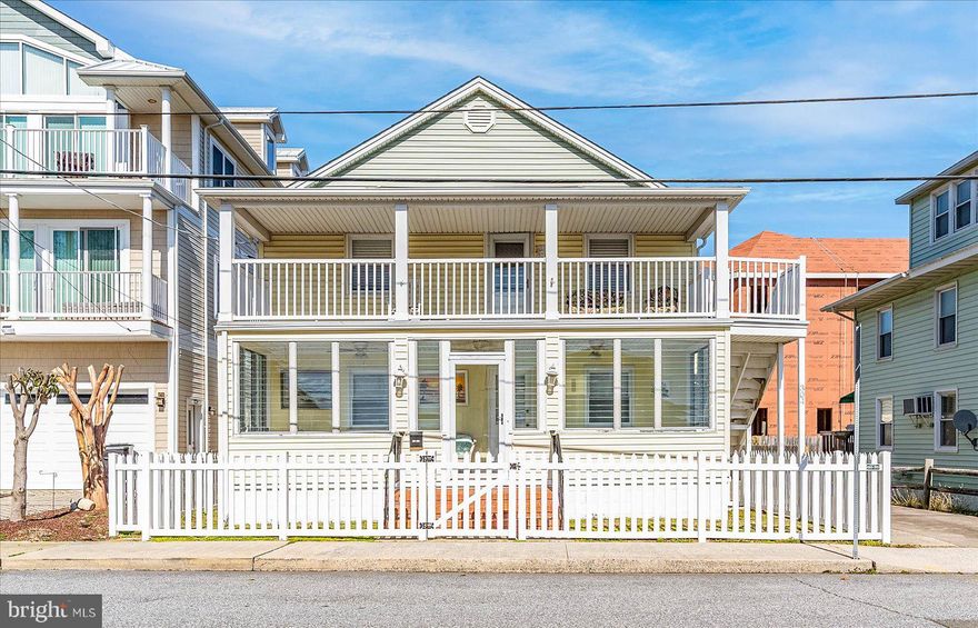 Exceptional opportunity to own a waterfront 2-unit property in the heart of Ocean City with 2 private boat slips and strong appeal for investors, second-home buyers, or those seeking flexible multi-generational use. Comprised of a 3BR/3BA first-floor unit and a 2BR/1BA second-floor unit, this renovated R-2 property offers versatility for short-term rental, seasonal use, annual rental, or owner-occupied income-producing use. The detached garage may offer potential for conversion to additional living space, subject to zoning requirements and approvals. In addition to the 2 private boat slips, highlights include canal and bay views, private entrances, enclosed porch/sunroom areas, private garage, and extensive recent improvements. A private deck on the lower unit overlooks the water and fenced-in yard.  Inside, both kitchens have been recently renovated, along with new LVP flooring, lighting fixtures, paint, and updated furniture, including an original Ocean City Boardwalk board dining table.  Located within walking distance to the beach, boardwalk, dining, shopping, and entertainment, this is a rare chance to market a true multi-family waterfront asset in a prime Ocean City location. With over $110,000 rental income, this is a rare chance to own a versatile waterfront property in with built-in flexibility and long-term value.