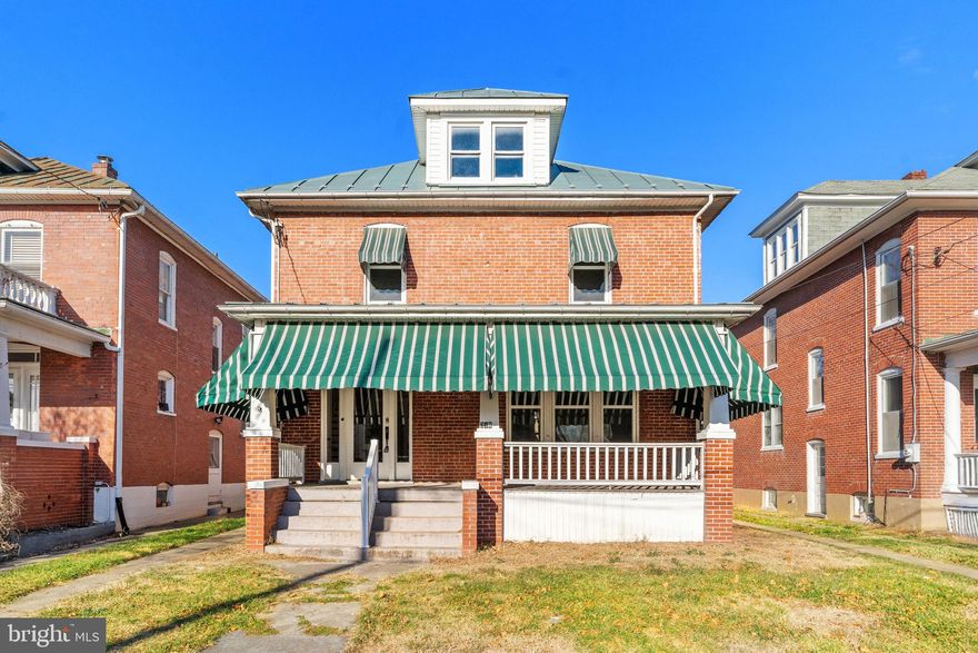 This delightful brick Colonial, perfectly situated in the heart of downtown Winchester, combines classic architecture with modern updates and an unbeatable location close to every downtown amenity, including restaurants, schools, shopping, parks, and major commuter routes. The home welcomes you with a large foyer featuring newly refinished hardwood floors that extend throughout the entire residence, complemented by fresh paint and an abundance of natural light. The remodeled kitchen is a highlight, boasting sleek white cabinetry and new stainless steel appliances, while a convenient half bath is also located on the main level. Upstairs, you will find four generously-sized bedrooms, all with hardwood floors, and an updated full bathroom featuring a custom-tiled, large walk-in shower with a waterfall shower head. A unique sunroom adjacent to one of the bedrooms offers a flexible space perfect for a sitting area, library, home office, or even an oversized walk-in closet. The property also includes a full unfinished basement & attic for storage, large covered front and back porches for outdoor enjoyment, a private yard, and valuable amenities like prime off-street parking and a detached garage/shed. Other updates include new plumbing, new HVAC (dual zone), new windows, electric and lighting. This is a rare opportunity to own a move-in ready home that perfectly balances downtown living with residential comfort and classic charm.