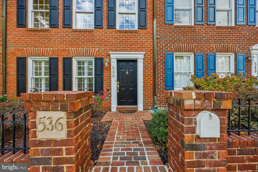 A stunning, ideally located brick front townhouse nestled in the heart of the highly desirable Kentlands community. Optimally located across from the Kentlands Clubhouse and recreation complex and lawns with basketball, pickleball and tennis courts, this immaculately maintained townhouse offers a wonderful melange of style, convenience and comfort.
This 4 bedroom 3.5 bathroom townhouse with 2,280 sq. ft. of living space offers appropriate floor coverings for the bedroom levels and hardwood floors at the entrance and main level.
The entry affords a spacious sitting/den area with a full-size bedroom/office and full mordern bath.
Step upstairs to discover a spacious bright living and dining room featuring a double-sided glass fireplace. The well-appointed, fully-equipped kitchen boasts stainless steel appliances, granite counter tops and pantry storage, perfect for culinary enthusiasts. The kitchen opens onto the deck featuring a motorized, retractable awning perfect for outdoor entertaining, overlooking the well-manicured patio which leads to the two-car carriage house garage.
Upstairs, the primary suite has dramatic vaulted ceilings, a spacious ensuite bath with a soaking tub, and a walk-in closet.
The upper level offers two additional bedrooms and a full second bathroom.
This well-appointed inviting townhouse offers the exceptional opportunity to enjoy this coveted community.