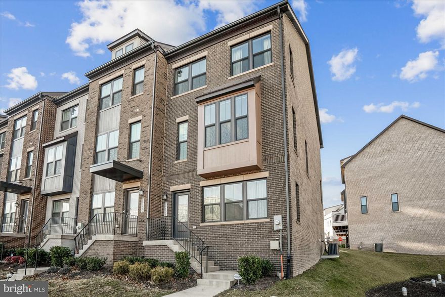 Welcome home to a bright, well-designed townhome with a private balcony and an ideal location near Whole Foods, Starbucks, Riverdale Station, Trader Joe’s, and Target. Convenient to the University of Maryland, with Hyattsville Crossing Metro (Green + Yellow Lines) about a 6-minute walk away.

The entry level offers a flexible space that works well as a home office, workout area, media room, or guest setup. On the main level, the open layout is built for everyday living and entertaining, centered around a standout kitchen with quality appliances and a large island with seating—flowing seamlessly into the dining area and spacious living room.

Positioned on a corner, this end-unit offers uncommon privacy and open sightlines compared to other homes in the community. The upper level is wrapped in windows, bringing in strong natural light and offering views of trees and water—an added benefit you don’t often find in this setting.

Upstairs, the primary suite includes an en-suite bath and generous closet space, plus two additional bedrooms and a full hall bath. With smart storage and flexible living across every level, this home is designed to support a range of lifestyles.