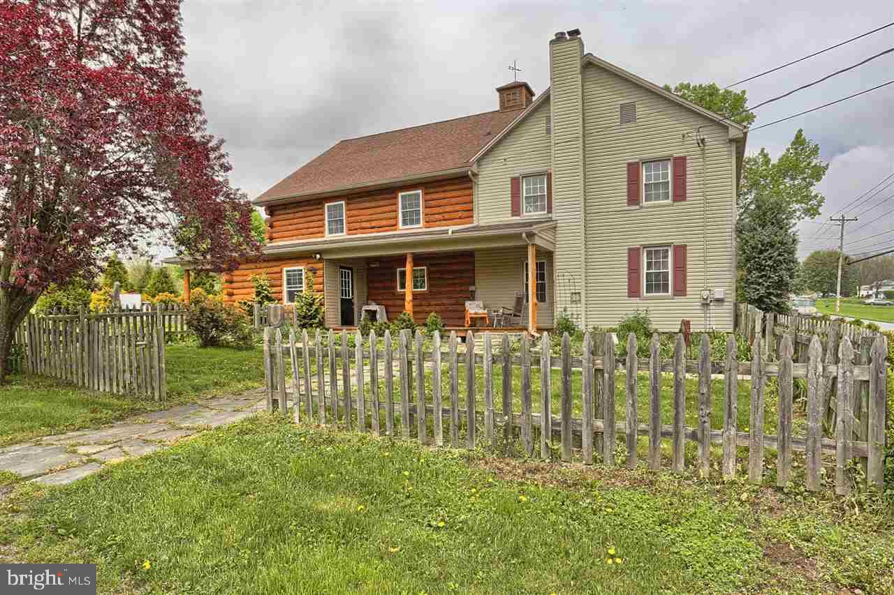 This enchanting home honors the memory of a time gone past while offering the modern amenities sought after by today's homeowners. Originally built in 1730 with a modern log addition in 2006. This stunning home features spacious rooms, hardwood floors, updated baths, kitchen and living areas. 1800 barn has been updated and has multiple uses including running a food service business out of the barn.