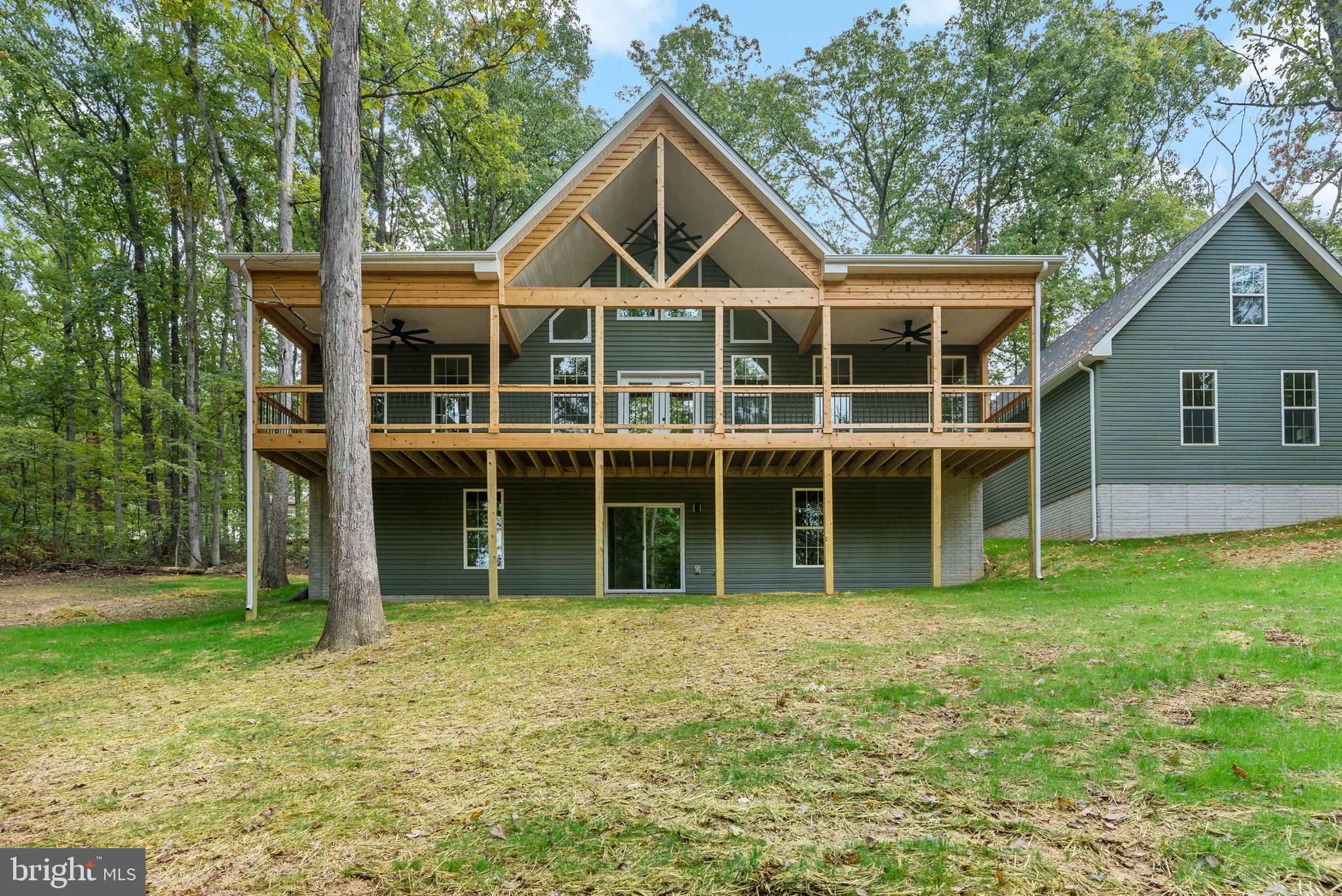 Welcome to your dream home or weekend retreat situated on 2.79 wooded acres, offering the perfect blend of luxury and tranquility. This newly constructed 3-bedroom, 3-bathroom masterpiece boasts modern amenities and thoughtful design, making it the ideal retreat for those who value comfort and style.
Step inside to discover 9-foot ceilings creating a spacious and airy ambiance. The primary suite is a true sanctuary, featuring a 6-foot tiled shower with dual heads and a rainmaker, a double vanity, and a massive walk-in closet. Cathedral ceilings add a touch of grandeur, while the upgraded kitchen impresses with premium cabinets, a generous island perfect for meal prep and entertaining, and a cozy gas fireplace in the living room.
The living space extends outdoors to a large, covered front porch, crafted with Trex decking and cedar, perfect for relaxing and enjoying the serene surroundings. The laundry room is a model of efficiency, with a sink and abundant cabinetry for all your storage needs.
Above the garage, a spacious 14x30 third bedroom with a full bath offering privacy and convenience. The 3-car garage is equipped with jack shaft Lift Master openers for ease of access along with a pedestrian access door.
This home is built for future expansion, with a full walkout climate-controlled basement, 2x6 construction, luxury vinyl plank flooring, a 400-amp electric service, a tankless water heater, and an oversized heat pump. A $3,000 appliance credit allows you to choose your preferred appliances at Orsini’s.
Don’t miss the opportunity to make this exceptional property your forever home.